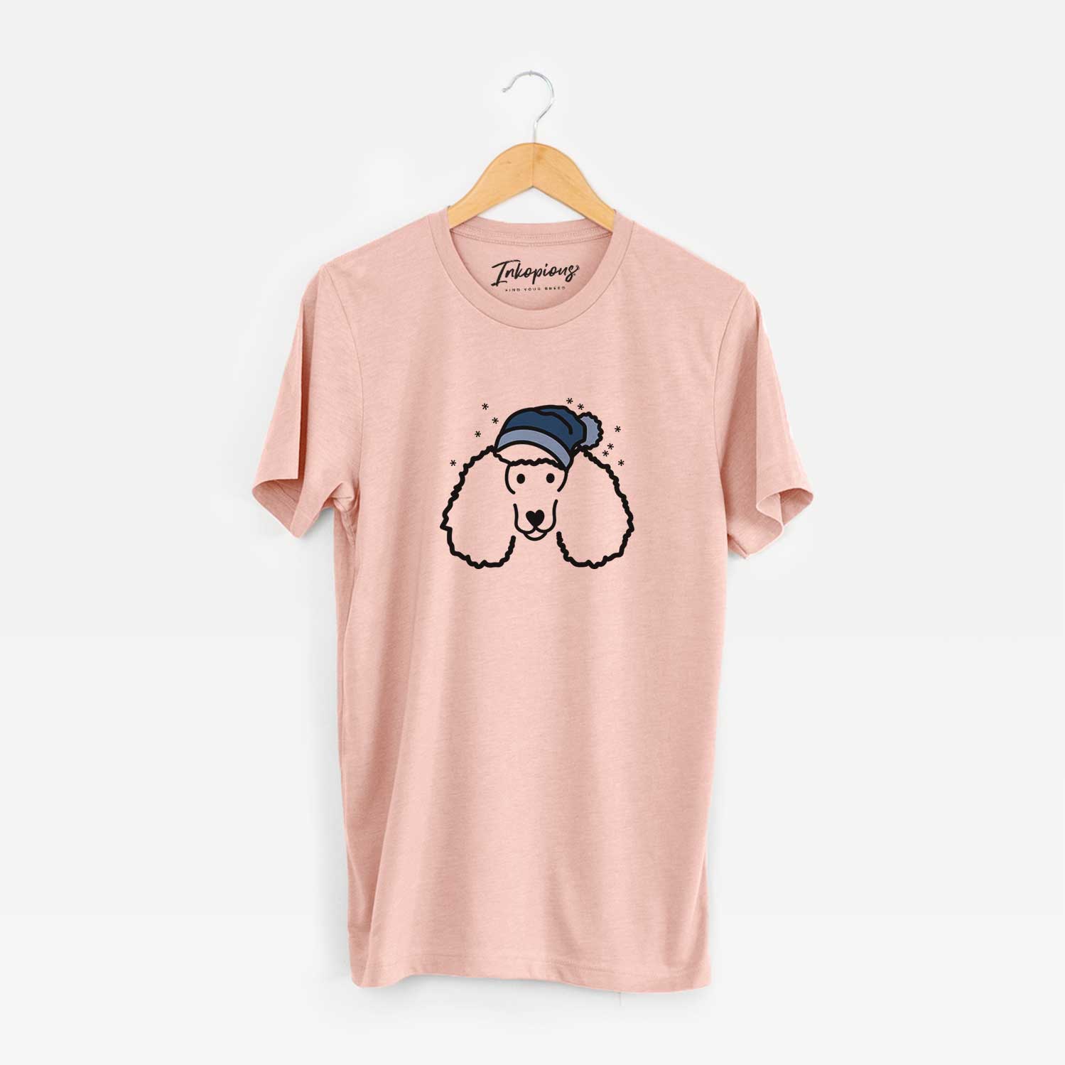 Minimalist line drawing of a Poodle wearing a winter beanie on a Peach Unisex crewneck