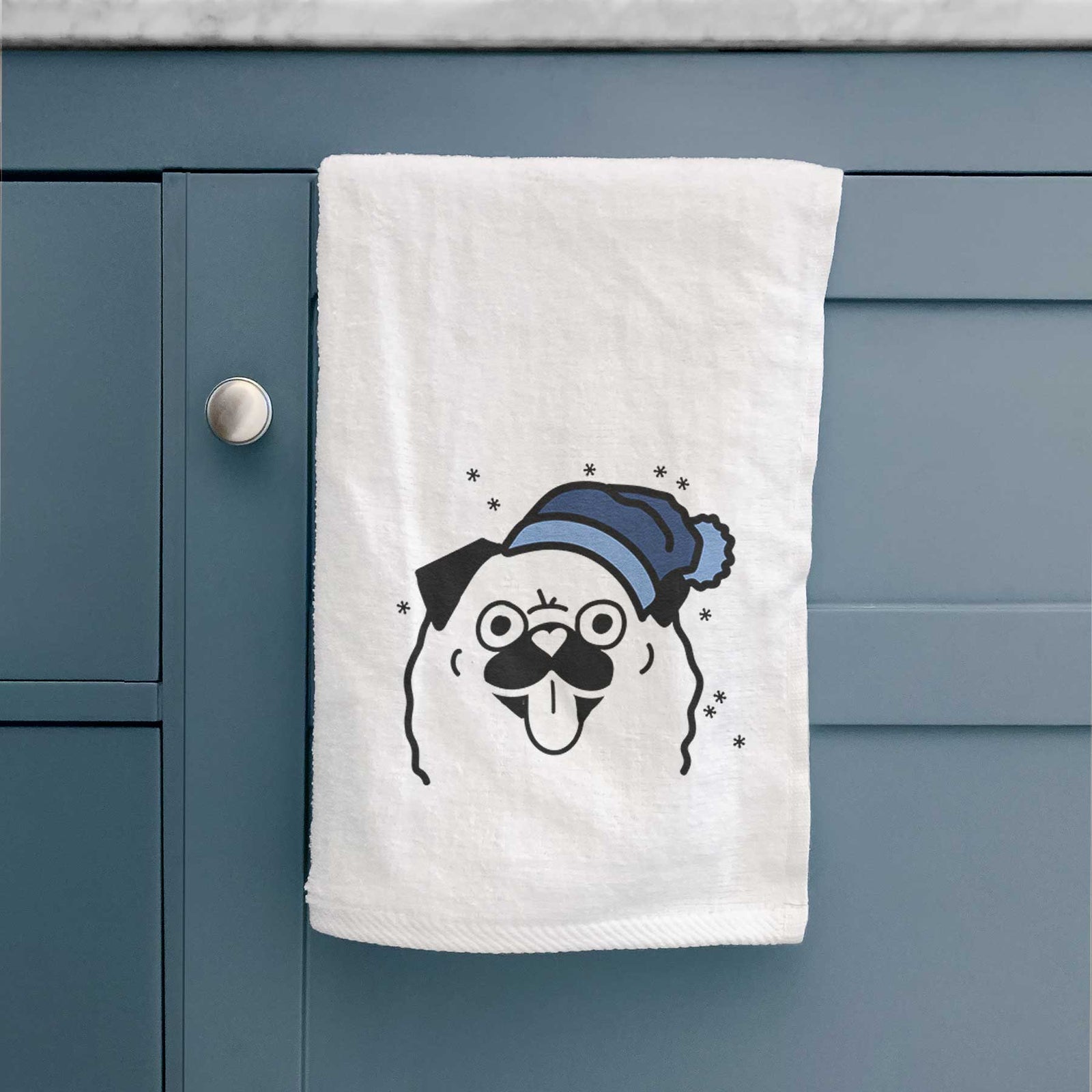 Minimalist line drawing of a Pug wearing a winter beanie on a decorative hand towel