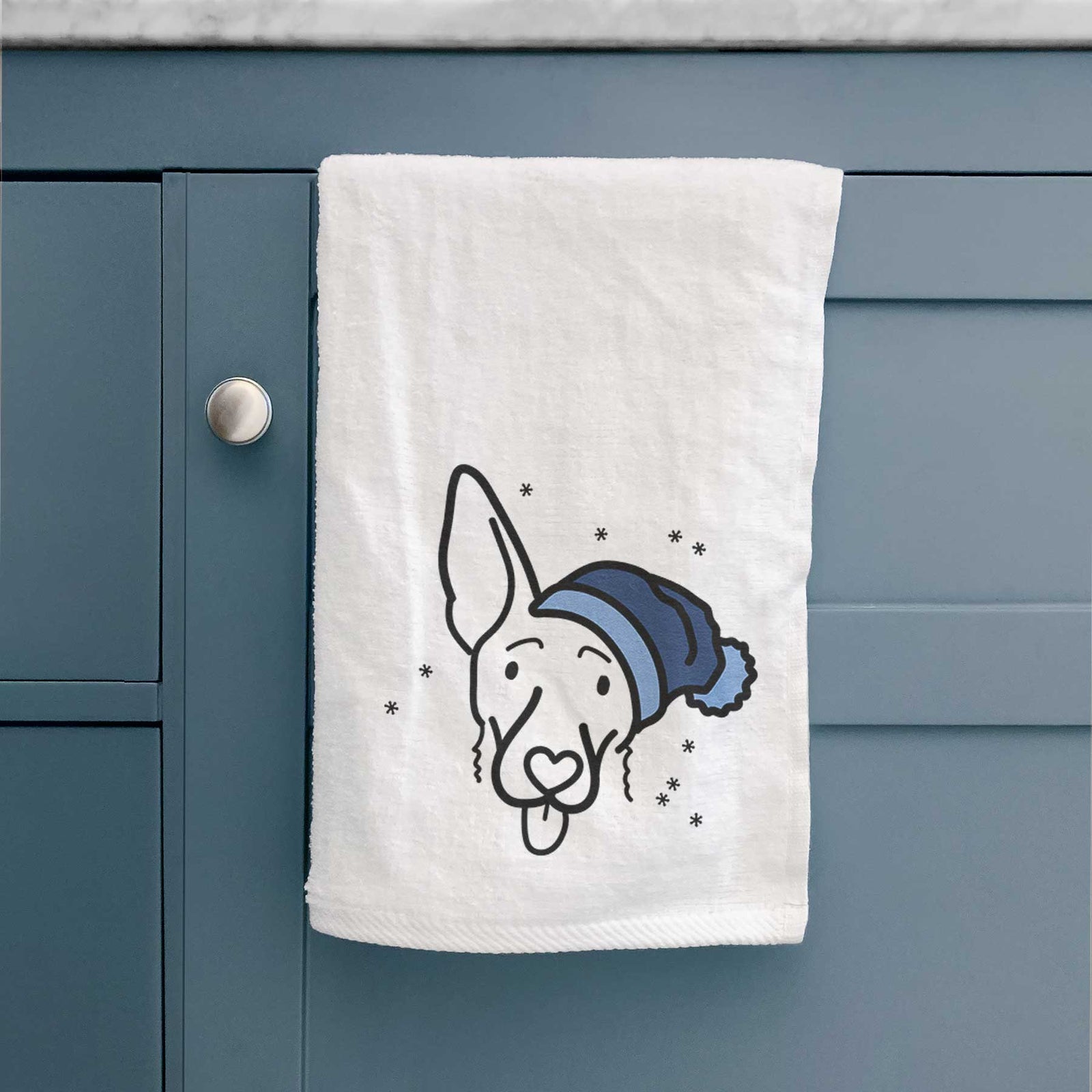 Minimalist line drawing of Rosie the Shepherd Mix wearing a winter beanie on a decorative hand towel