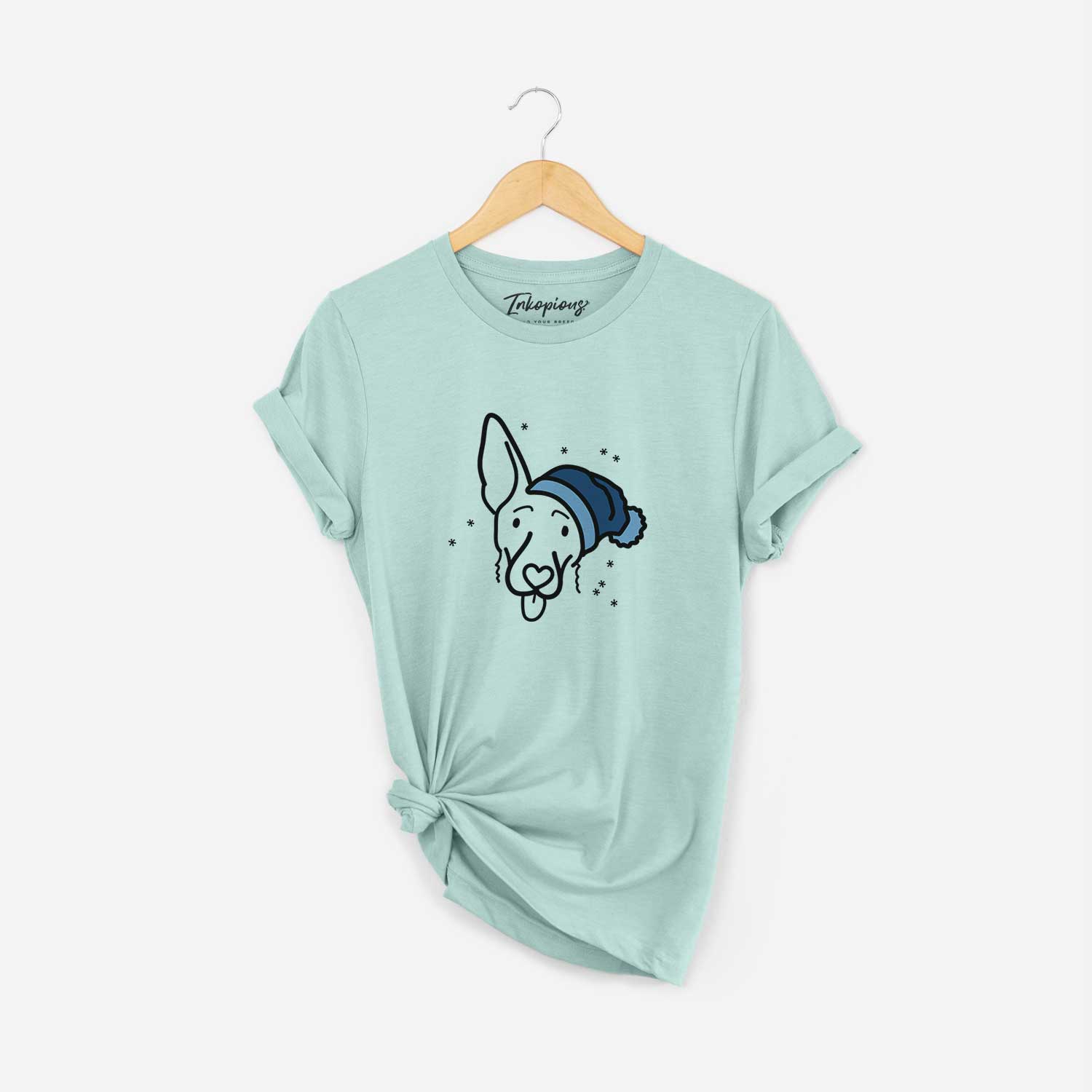 Minimalist line drawing of Rosie the Shepherd Mix wearing a winter beanie on a Heather Sage Unisex crewneck