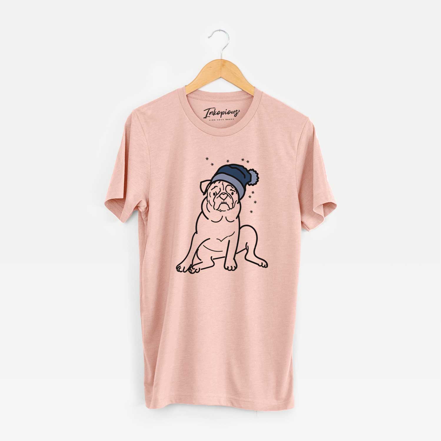 Minimalist line drawing of Rudy the Pug wearing a winter beanie on a Peach Unisex crewneck