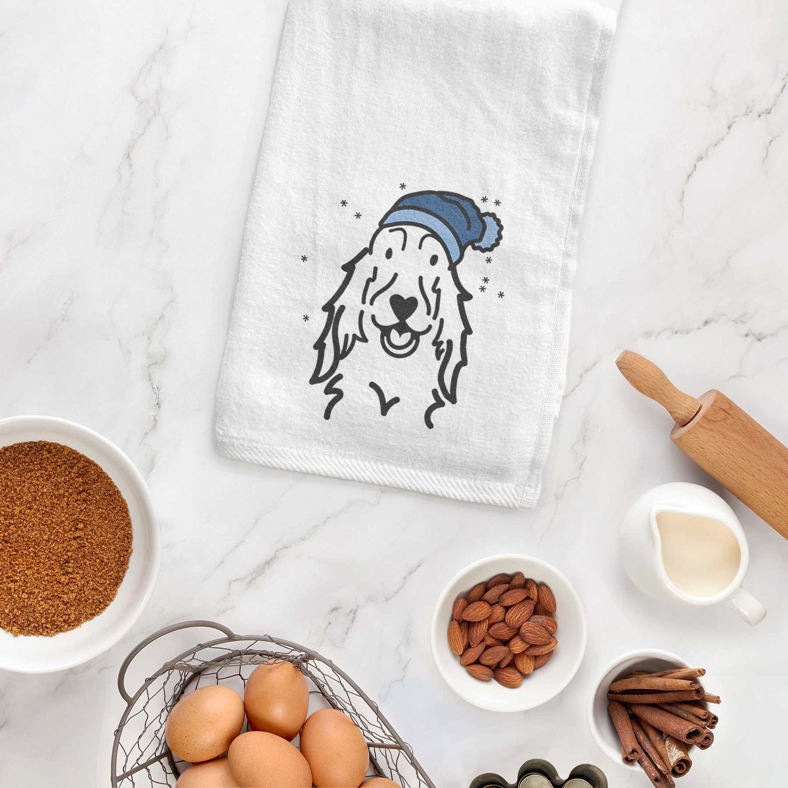 Minimalist line drawing of a Setter wearing a winter beanie on a decorative hand towel