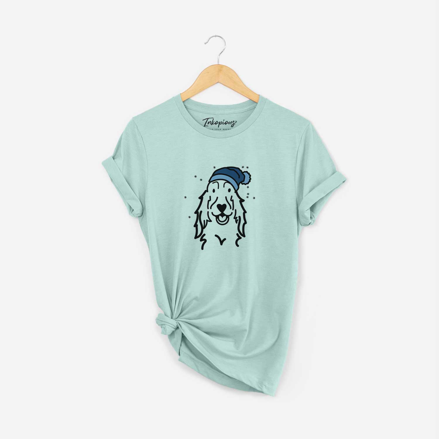 Minimalist line drawing of a Setter wearing a winter beanie on a Heather Sage Unisex crewneck