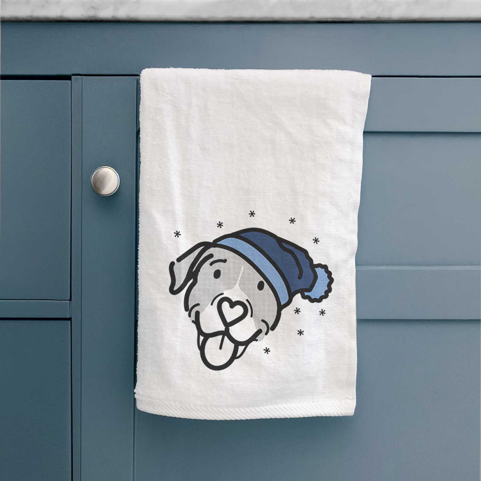 Minimalist line drawing of Shadow the Pitbull Mix wearing a winter beanie on a decorative hand towel