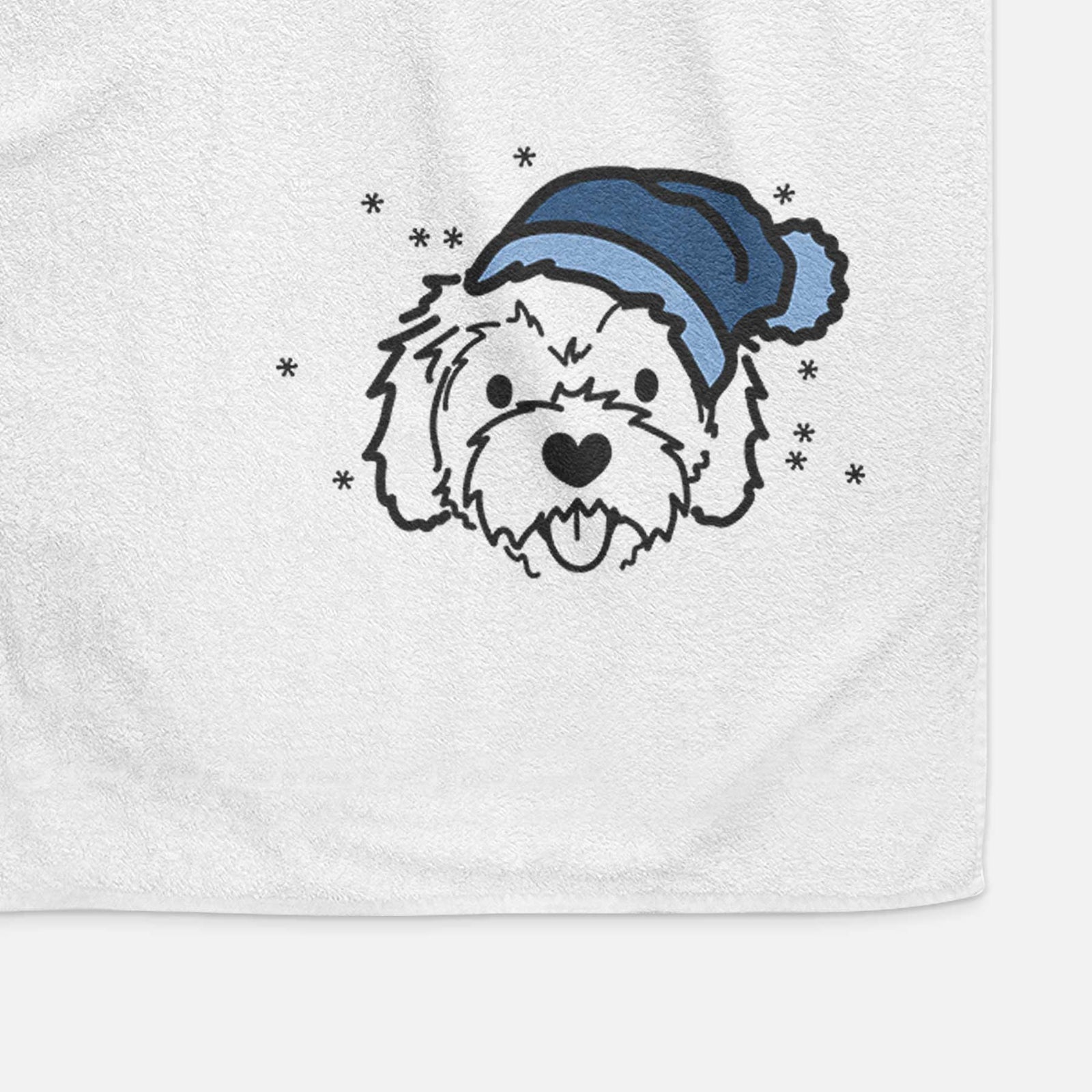 Minimalist line drawing of Sprinkles the Cockapoo wearing a winter beanie on a decorative hand towel