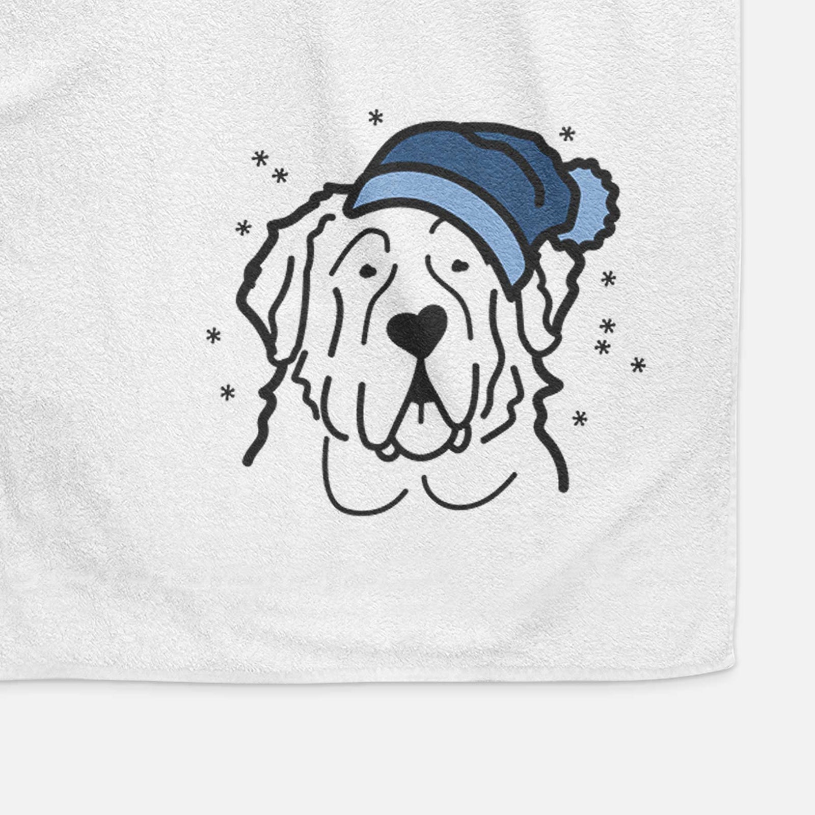 Minimalist line drawing of a Saint Bernard wearing a winter beanie on a decorative hand towel