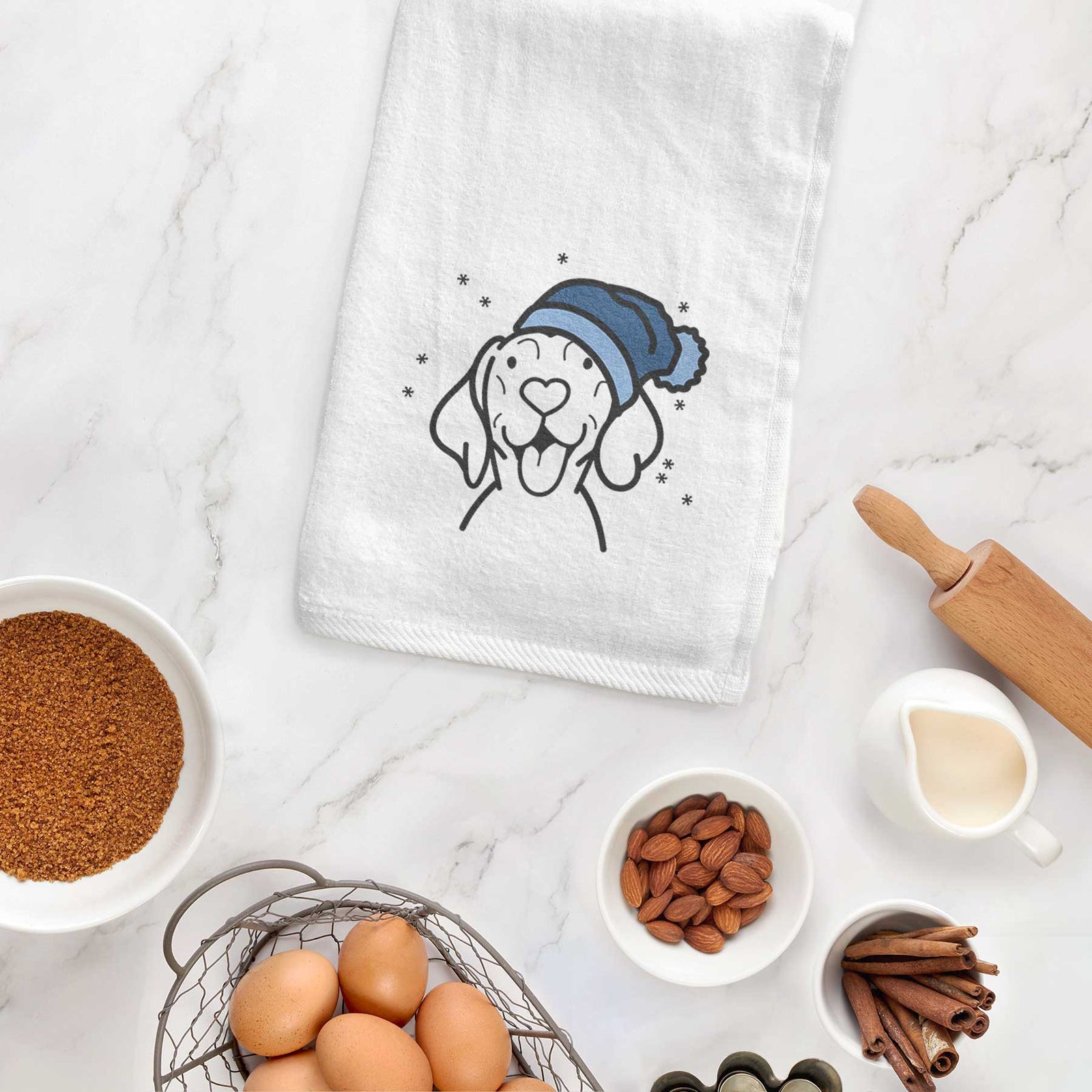 Minimalist line drawing of a Vizsla wearing a winter beanie on a decorative hand towel