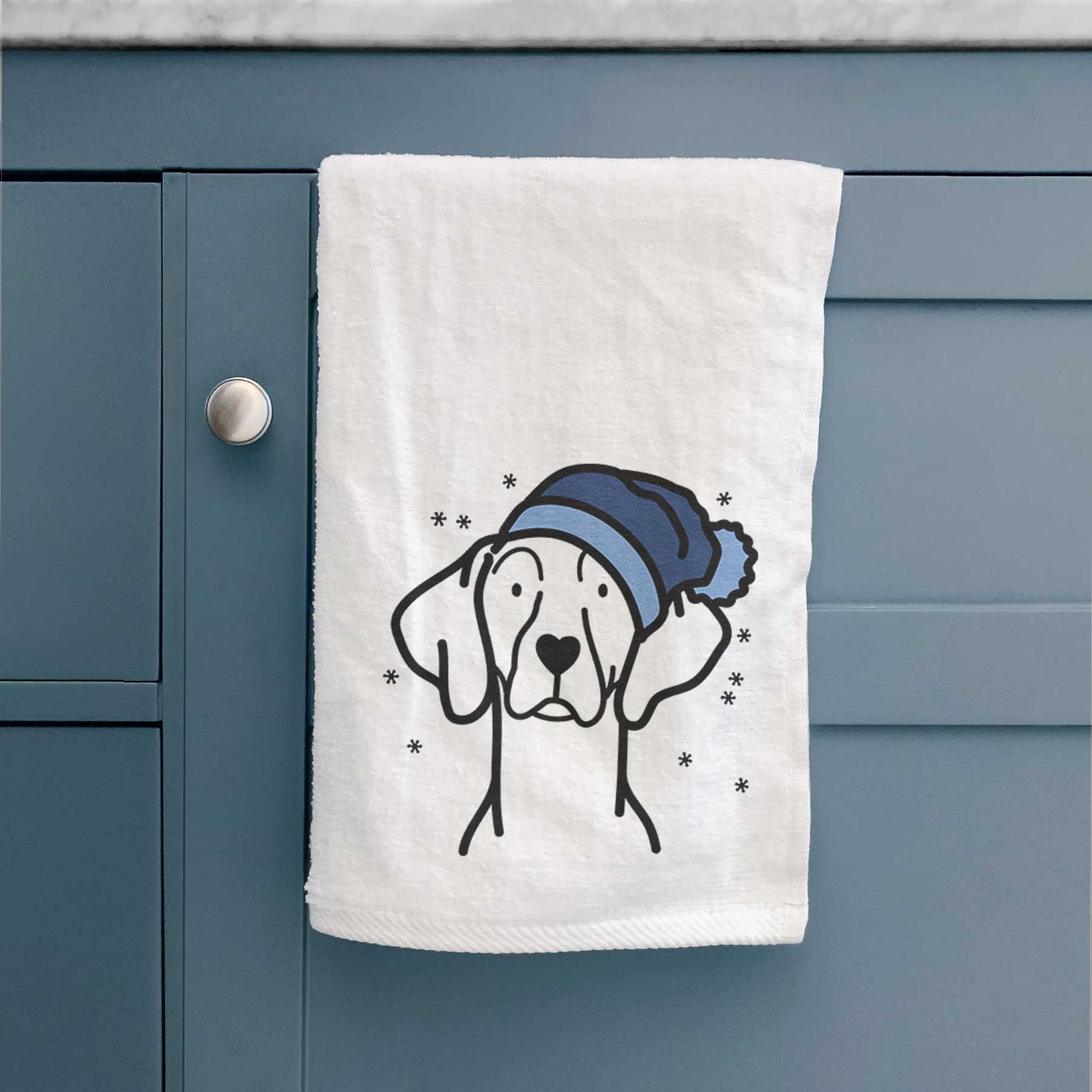 Minimalist line drawing of a Weimaraner wearing a winter beanie on a decorative hand towel
