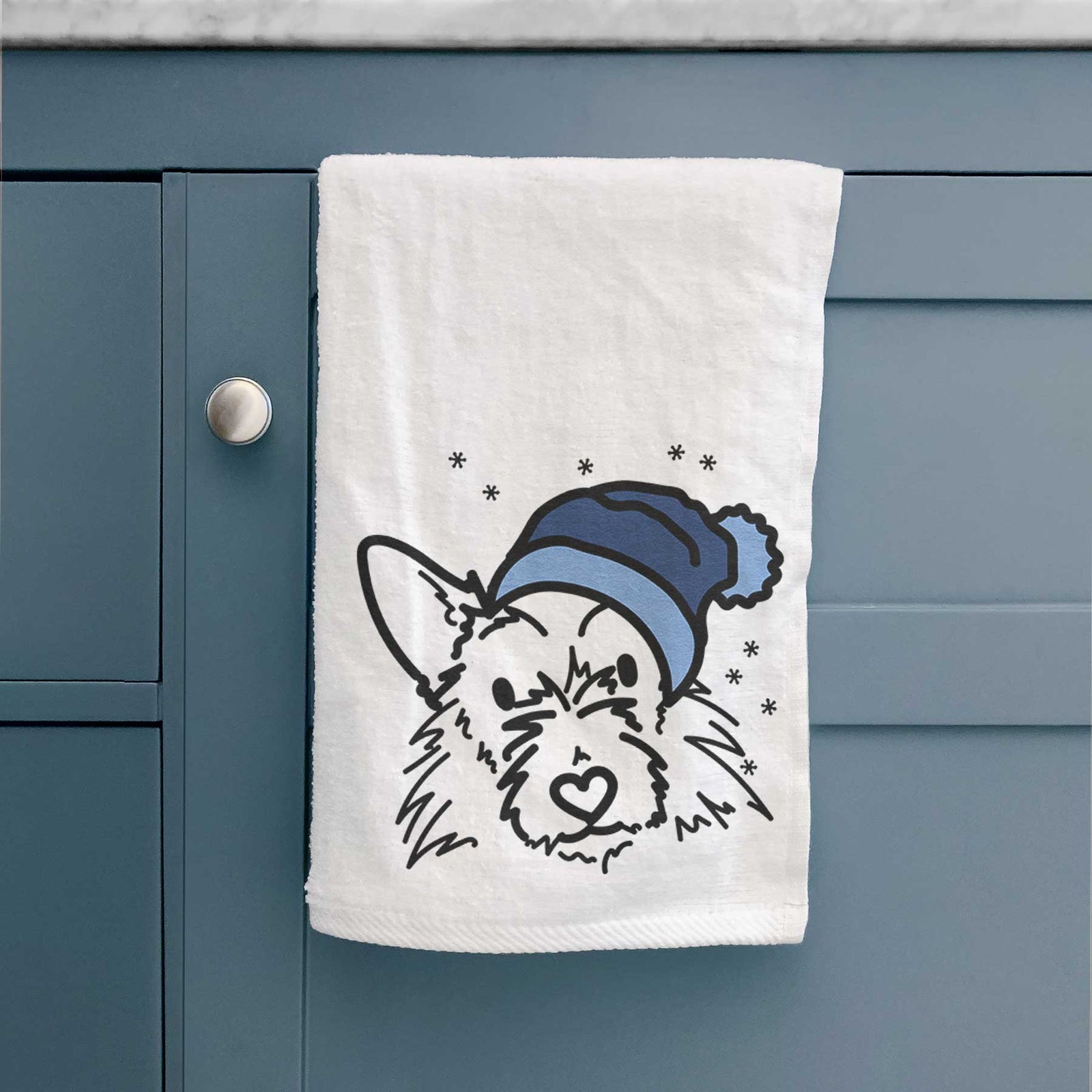 Minimalist line drawing of Ziggy the Terrier Mix wearing a winter beanie on a decorative hand towel