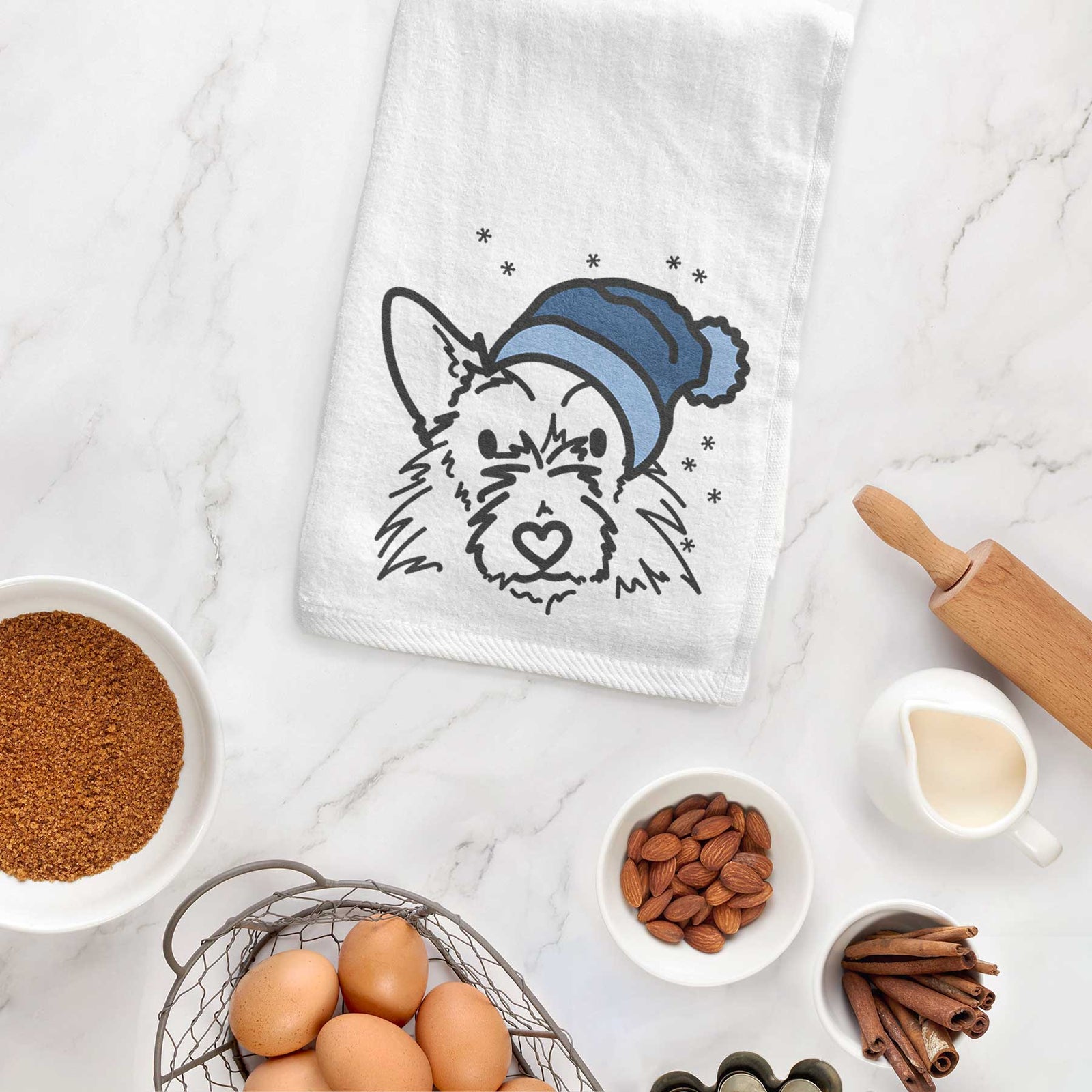 Minimalist line drawing of Ziggy the Terrier Mix wearing a winter beanie on a decorative hand towel