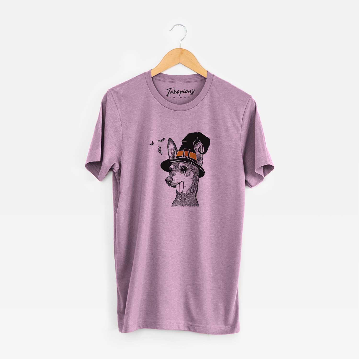 Hand-drawn sketch of Aaron the Chihuahua wearing a witch hat on an Orchid Unisex crewneck