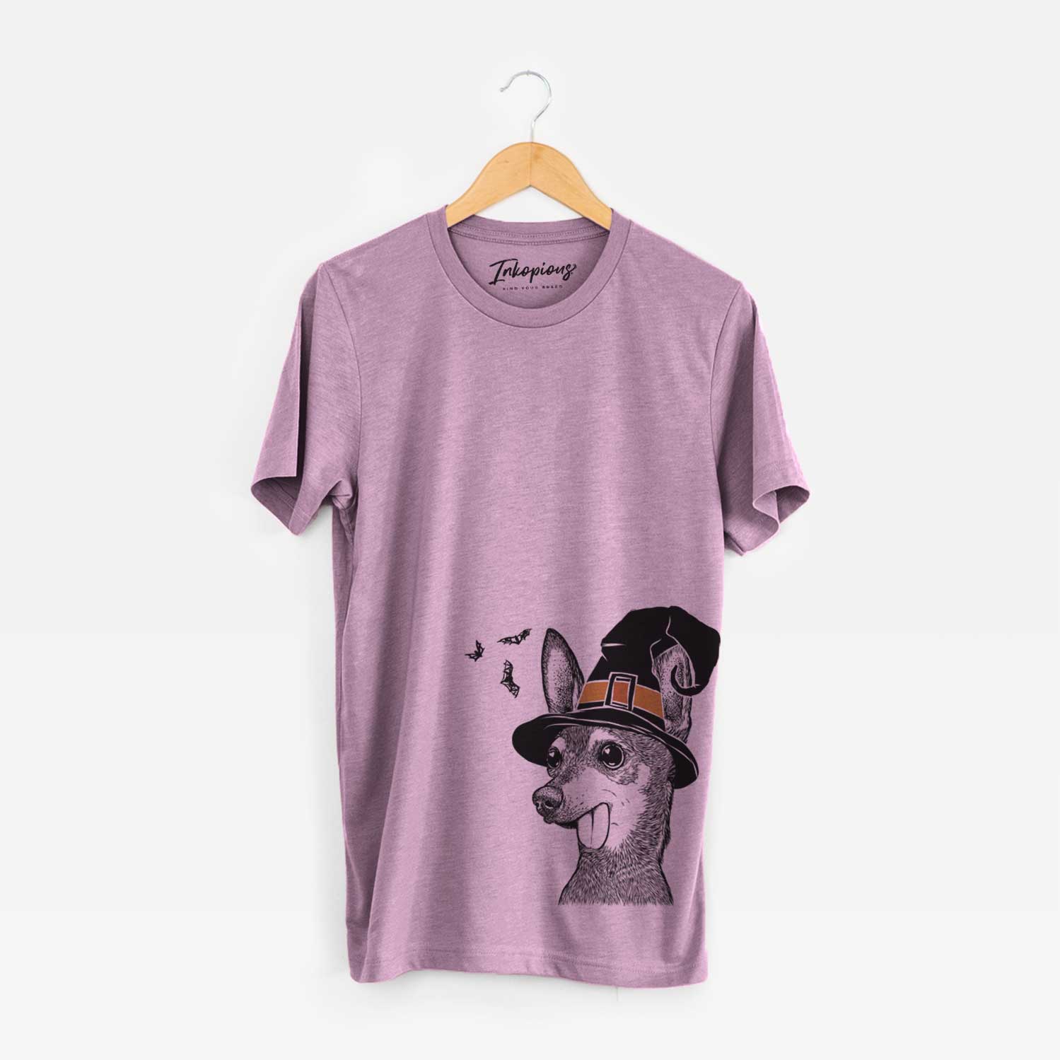 Hand-drawn sketch of Aaron the Chihuahua wearing a witch hat on an Orchid Unisex crewneck