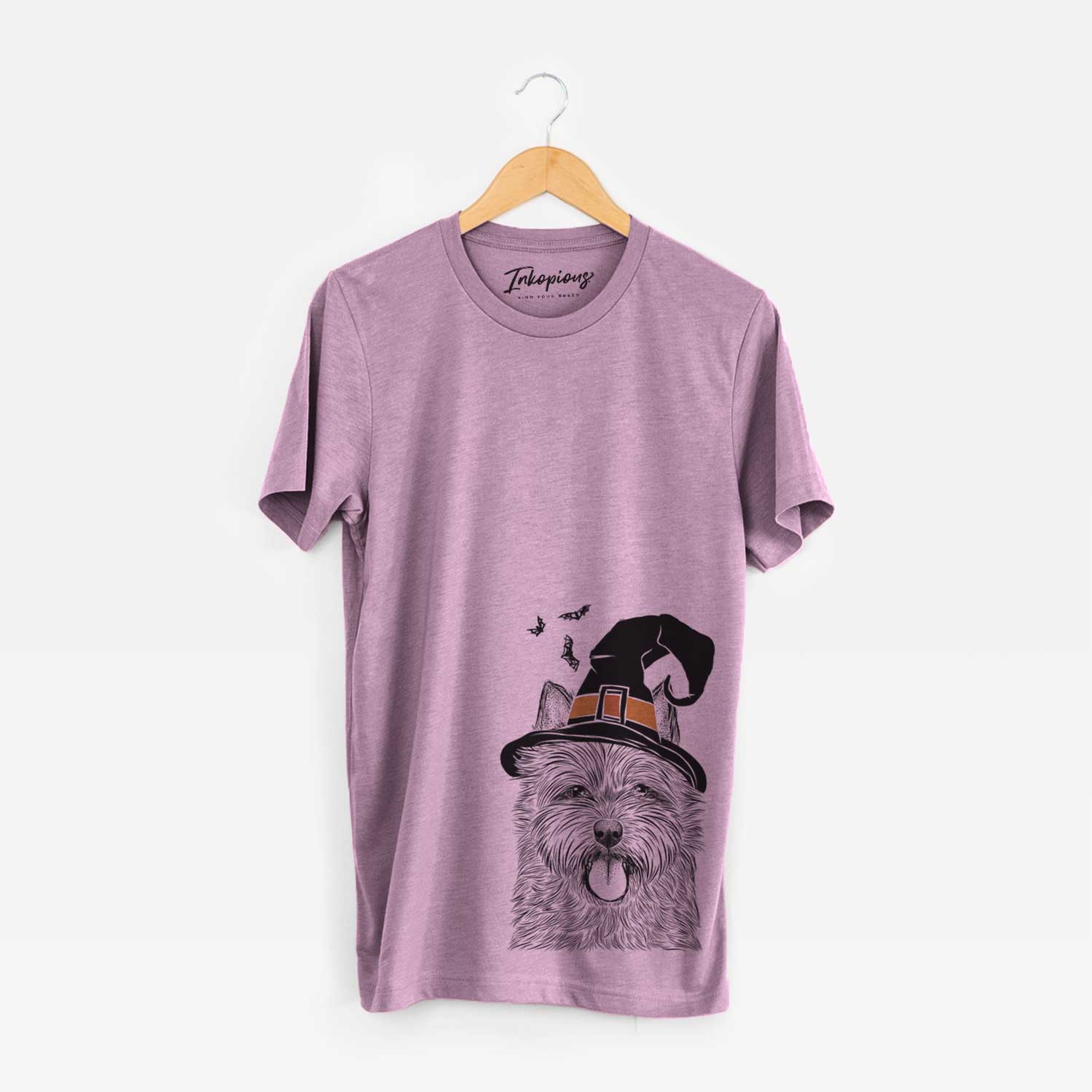 Hand-drawn sketch of Alfie the Norwich Terrier wearing a witch hat on an Orchid Unisex crewneck