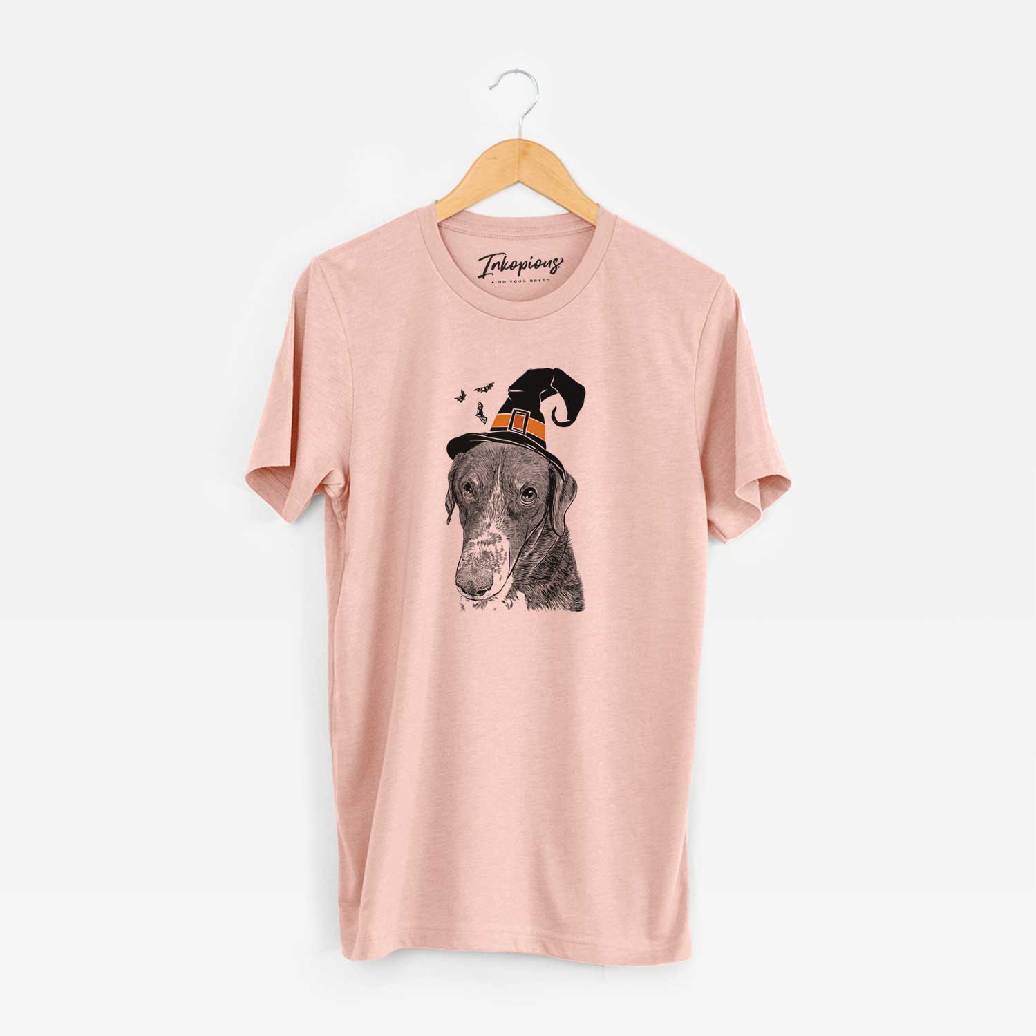 Hand-drawn sketch of Angel Orion the Mixed Breed wearing a witch hat on a Peach Unisex crewneck