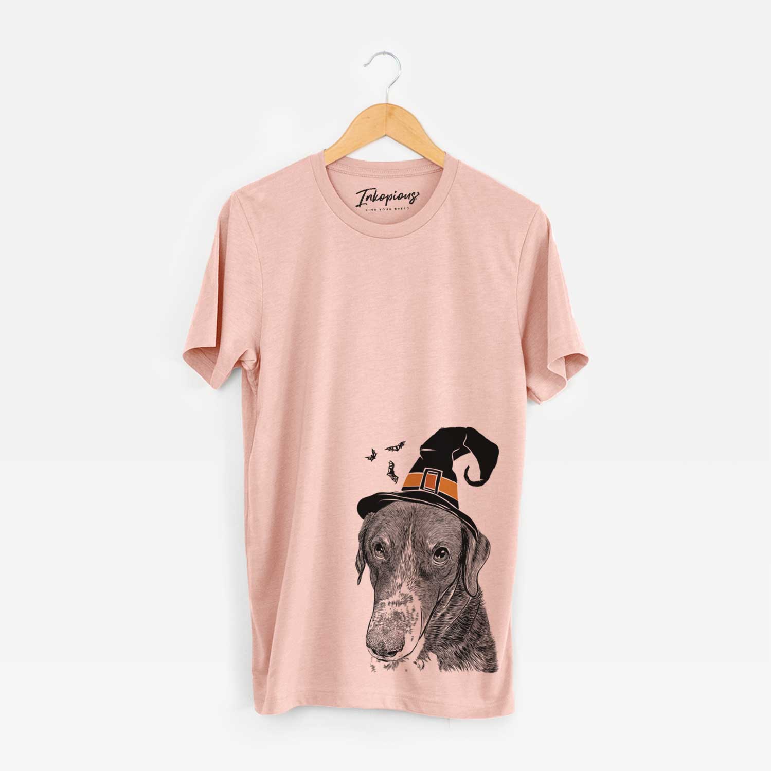 Hand-drawn sketch of Angel Orion the Mixed Breed wearing a witch hat on a Peach Unisex crewneck