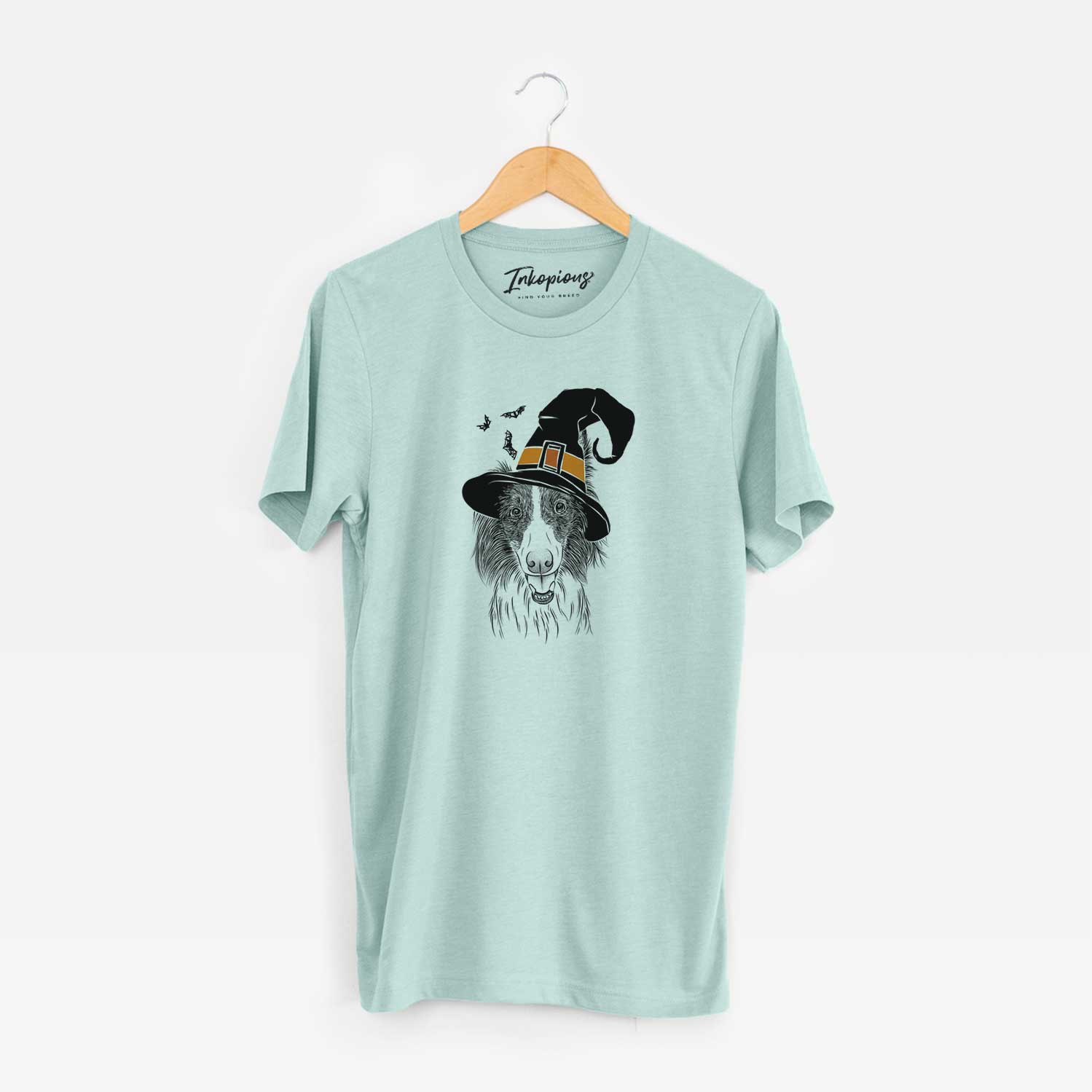Hand-drawn sketch of Archie the Silken Windhound wearing a witch hat on a Heather Sage Unisex crewneck