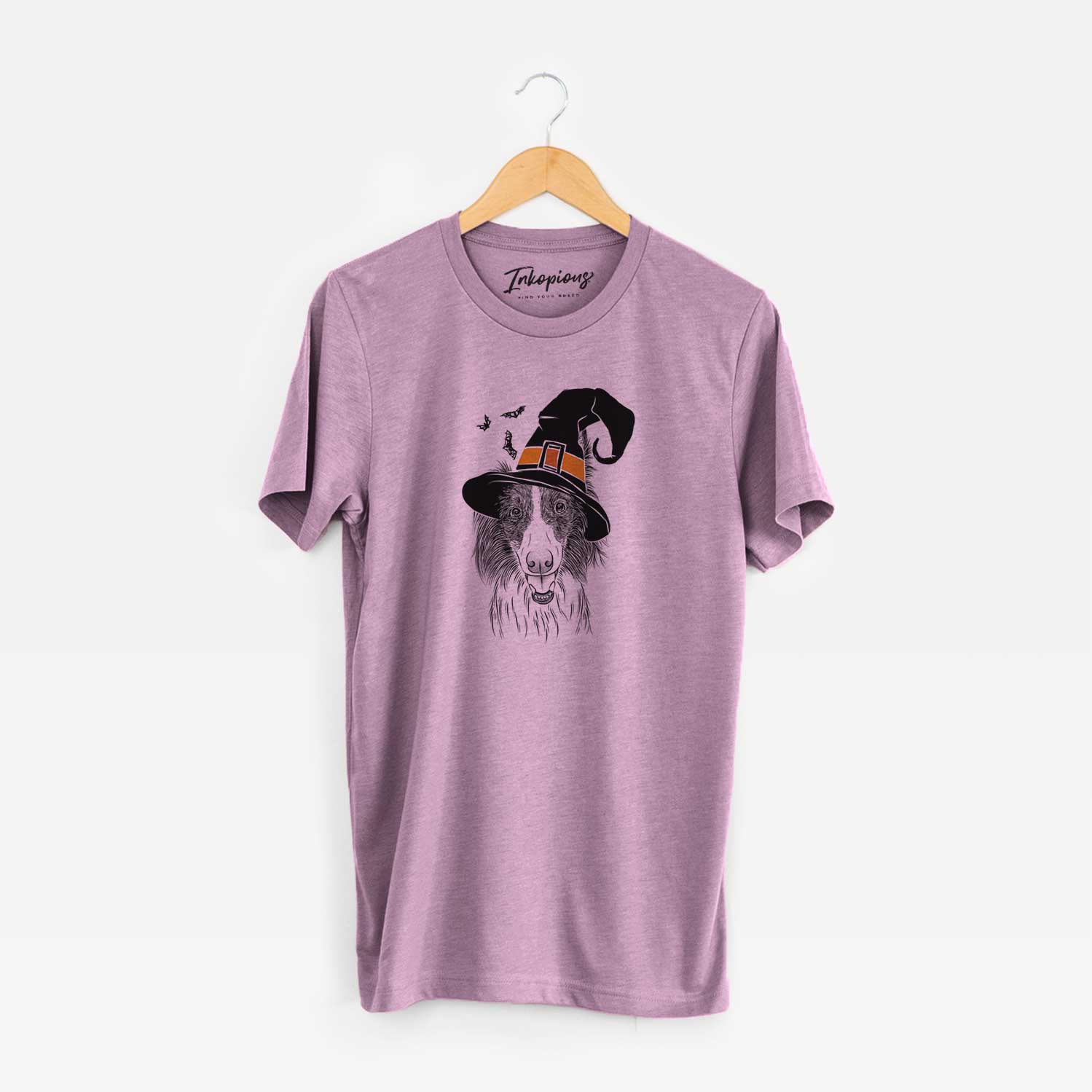 Hand-drawn sketch of Archie the Silken Windhound wearing a witch hat on an Orchid Unisex crewneck