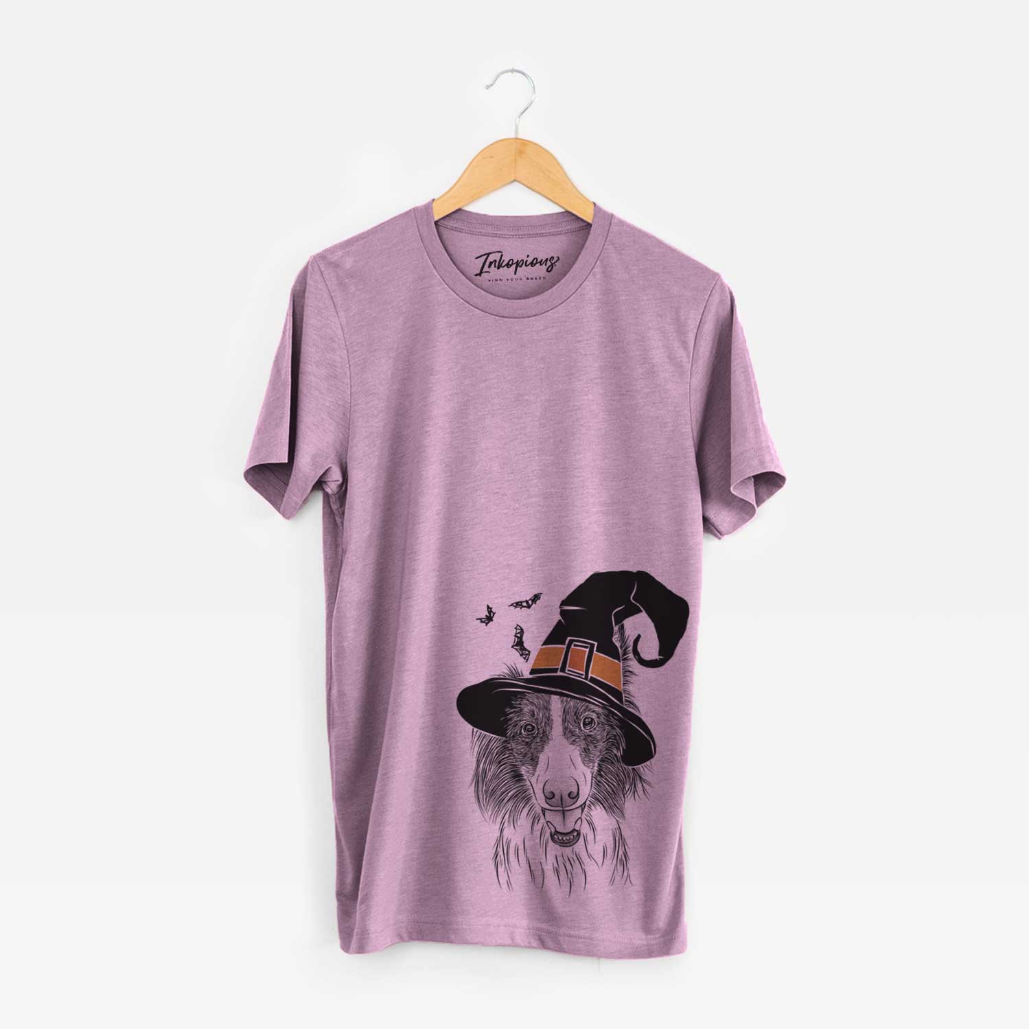 Hand-drawn sketch of Archie the Silken Windhound wearing a witch hat on an Orchid Unisex crewneck