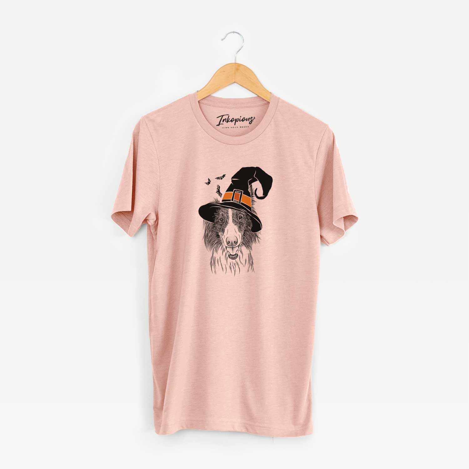 Hand-drawn sketch of Archie the Silken Windhound wearing a witch hat on a Peach Unisex crewneck