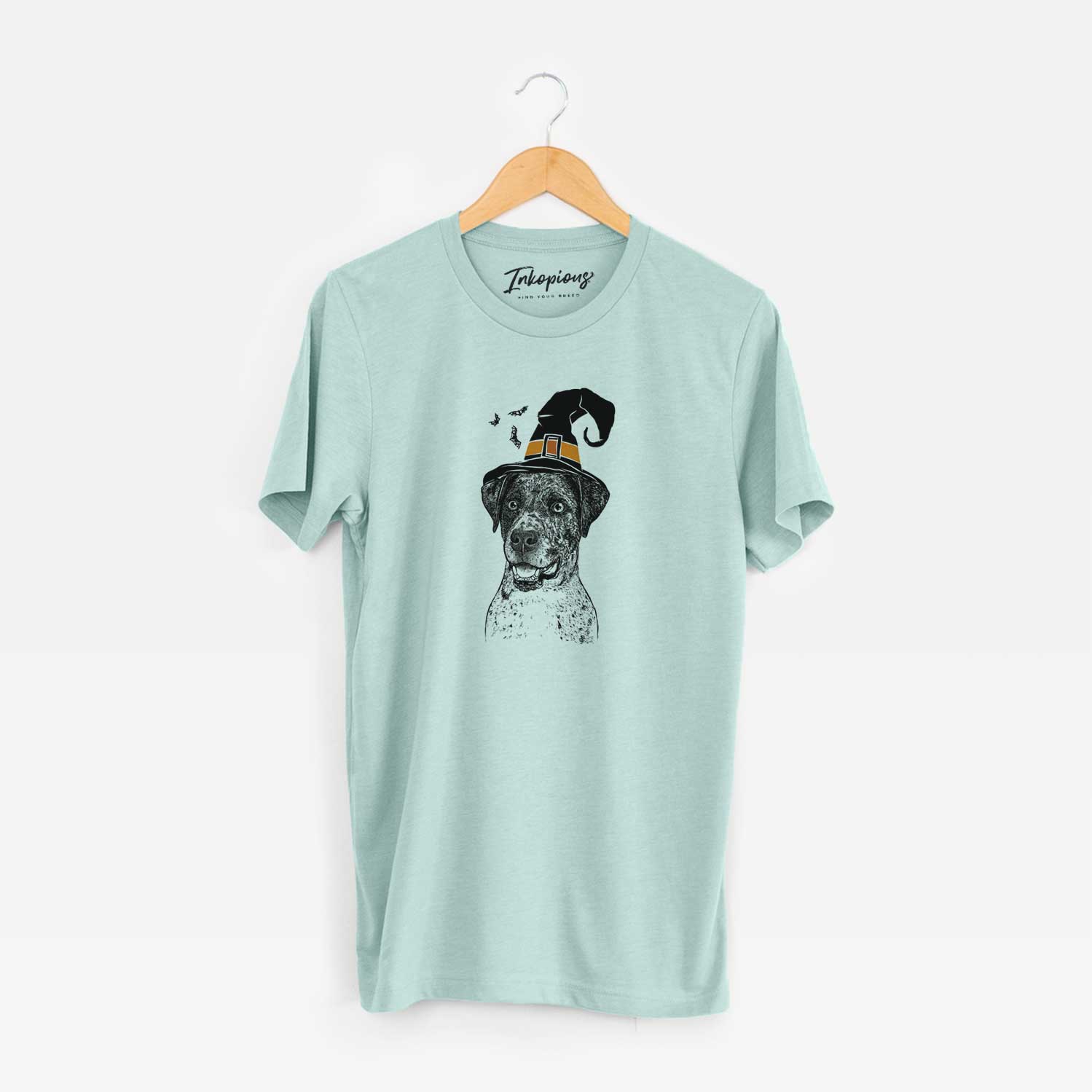 Hand-drawn sketch of Argos the Catahoula wearing a witch hat on a Heather Sage Unisex crewneck