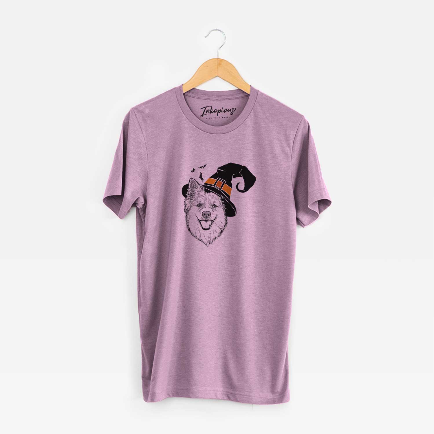 Hand-drawn sketch of Ari the Icelandic Sheepdog wearing a witch hat on an Orchid Unisex crewneck