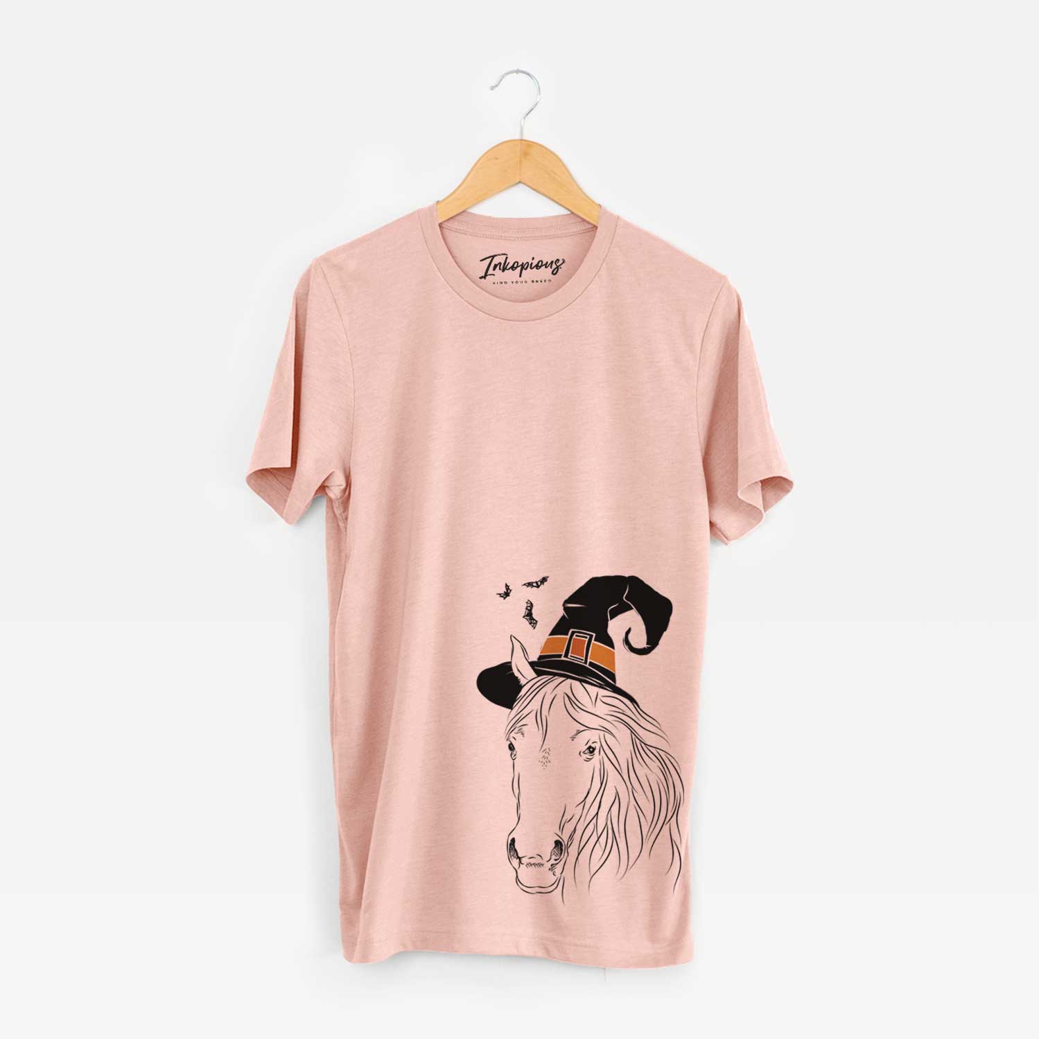 Hand-drawn sketch of Aria the Horse wearing a witch hat on a Peach Unisex crewneck