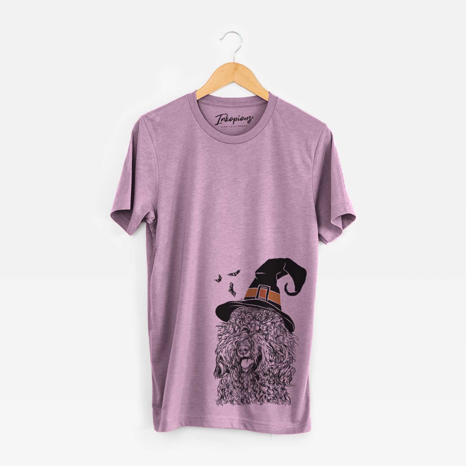 Hand-drawn sketch of Babs the Barbet wearing a witch hat on an Orchid Unisex crewneck