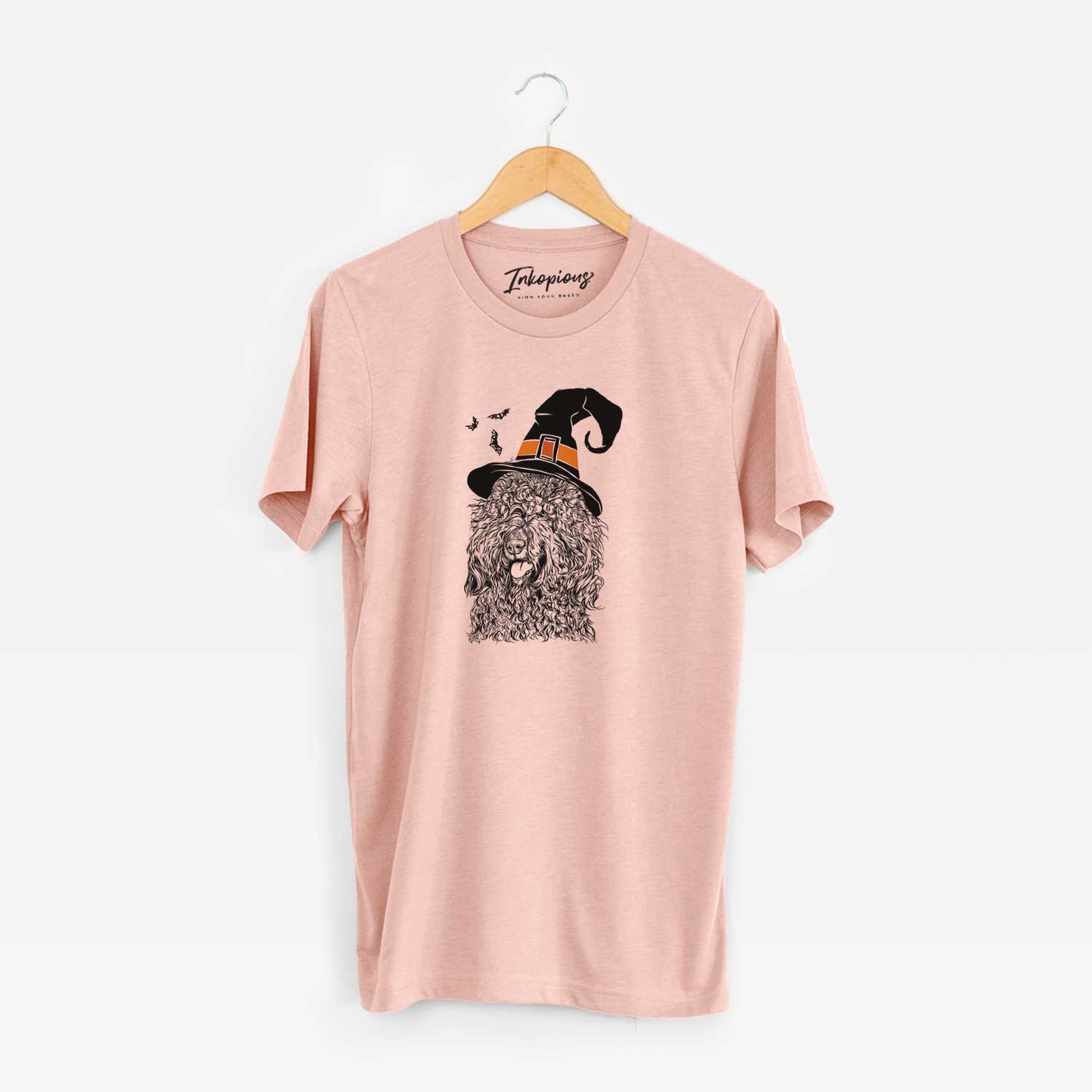 Hand-drawn sketch of Babs the Barbet wearing a witch hat on a Peach Unisex crewneck