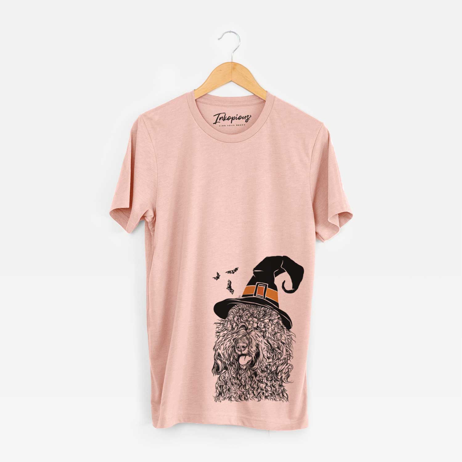 Hand-drawn sketch of Babs the Barbet wearing a witch hat on a Peach Unisex crewneck