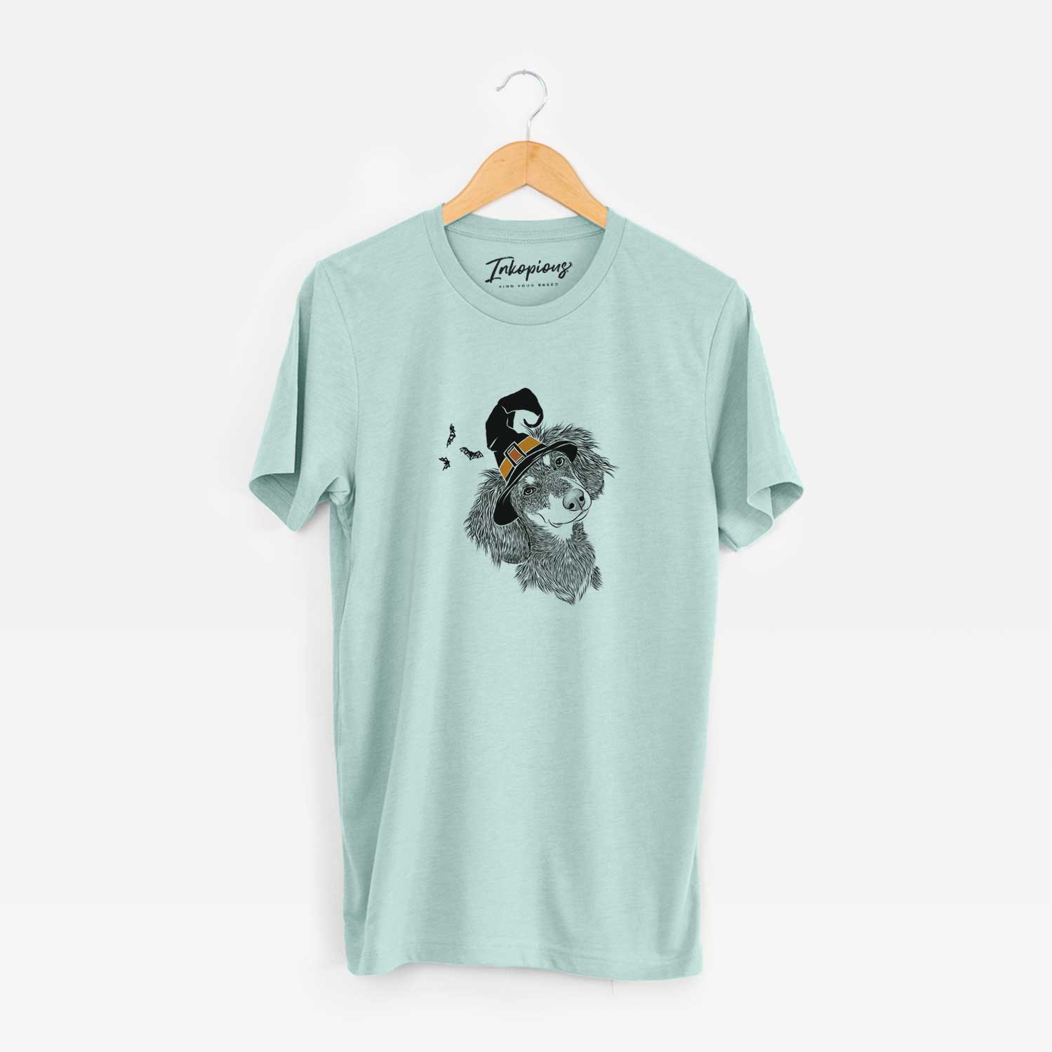 Hand-drawn sketch of Bailey the Long Haired Dachshund wearing a witch hat on a Heather Sage Unisex crewneck