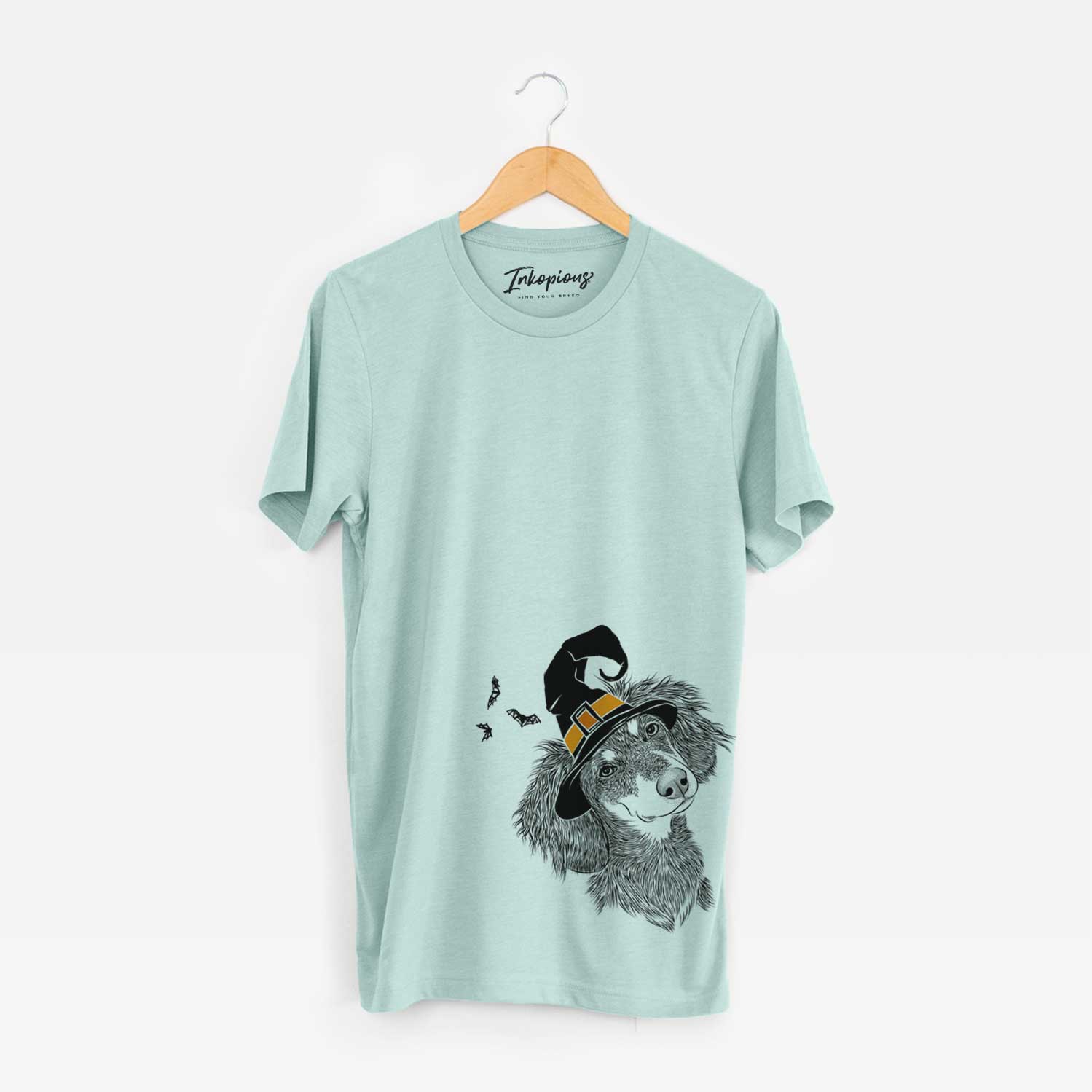 Hand-drawn sketch of Bailey the Long Haired Dachshund wearing a witch hat on a Heather Sage Unisex crewneck