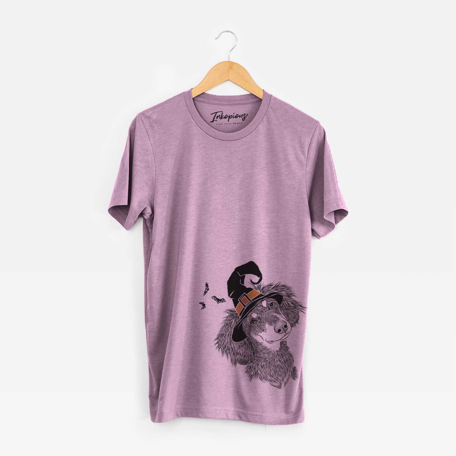 Hand-drawn sketch of Bailey the Long Haired Dachshund wearing a witch hat on an Orchid Unisex crewneck