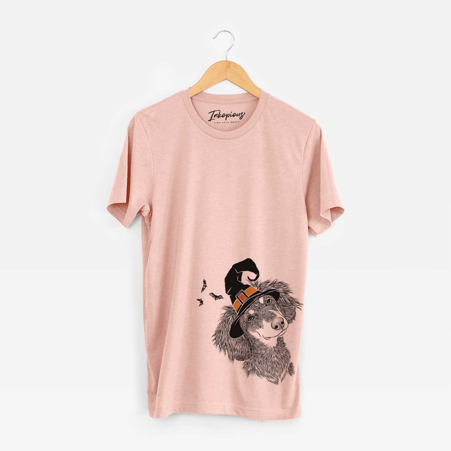 Hand-drawn sketch of Bailey the Long Haired Dachshund wearing a witch hat on a Peach Unisex crewneck