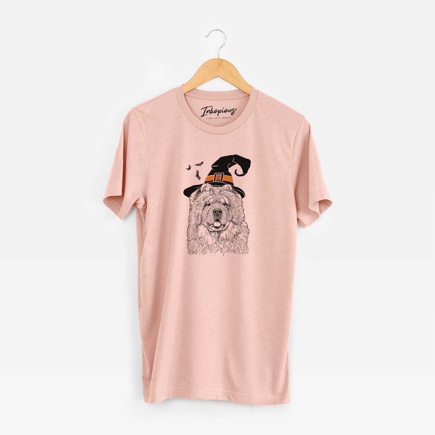 Hand-drawn sketch of Baloo the Chow Chow wearing a witch hat on a Peach Unisex crewneck