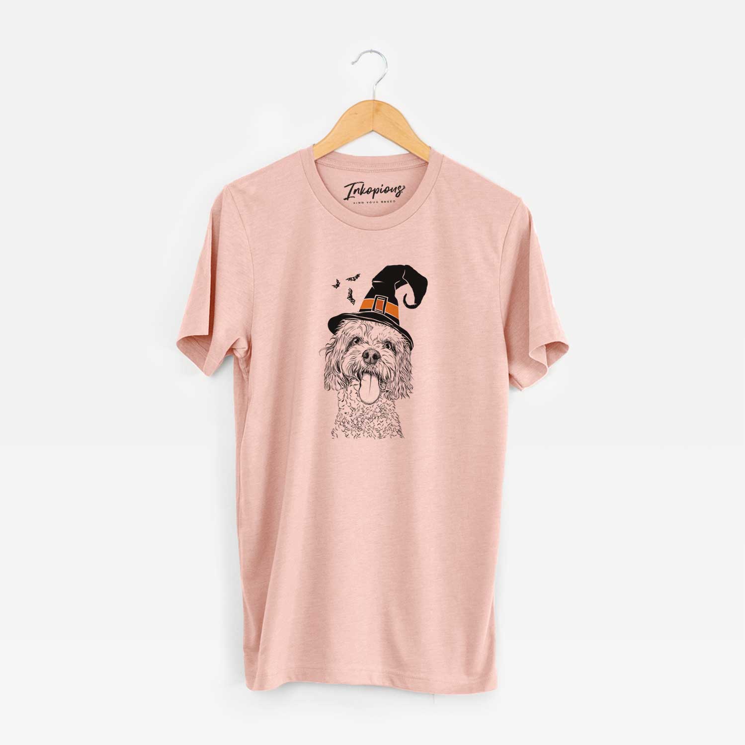 Hand-drawn sketch of Barney the Cavachon wearing a witch hat on a Peach Unisex crewneck