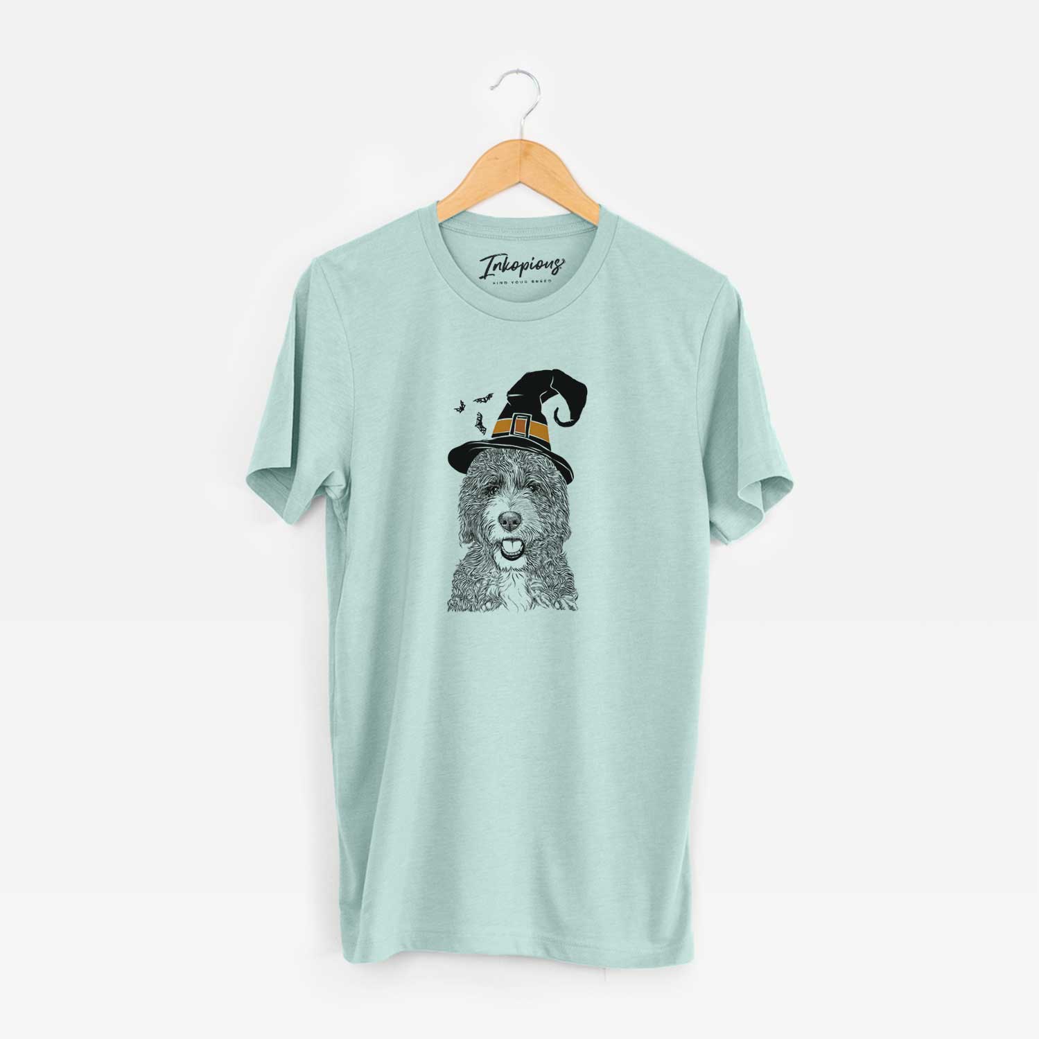 Hand-drawn sketch of Bash the Bernedoodle wearing a witch hat on a Heather Sage Unisex crewneck
