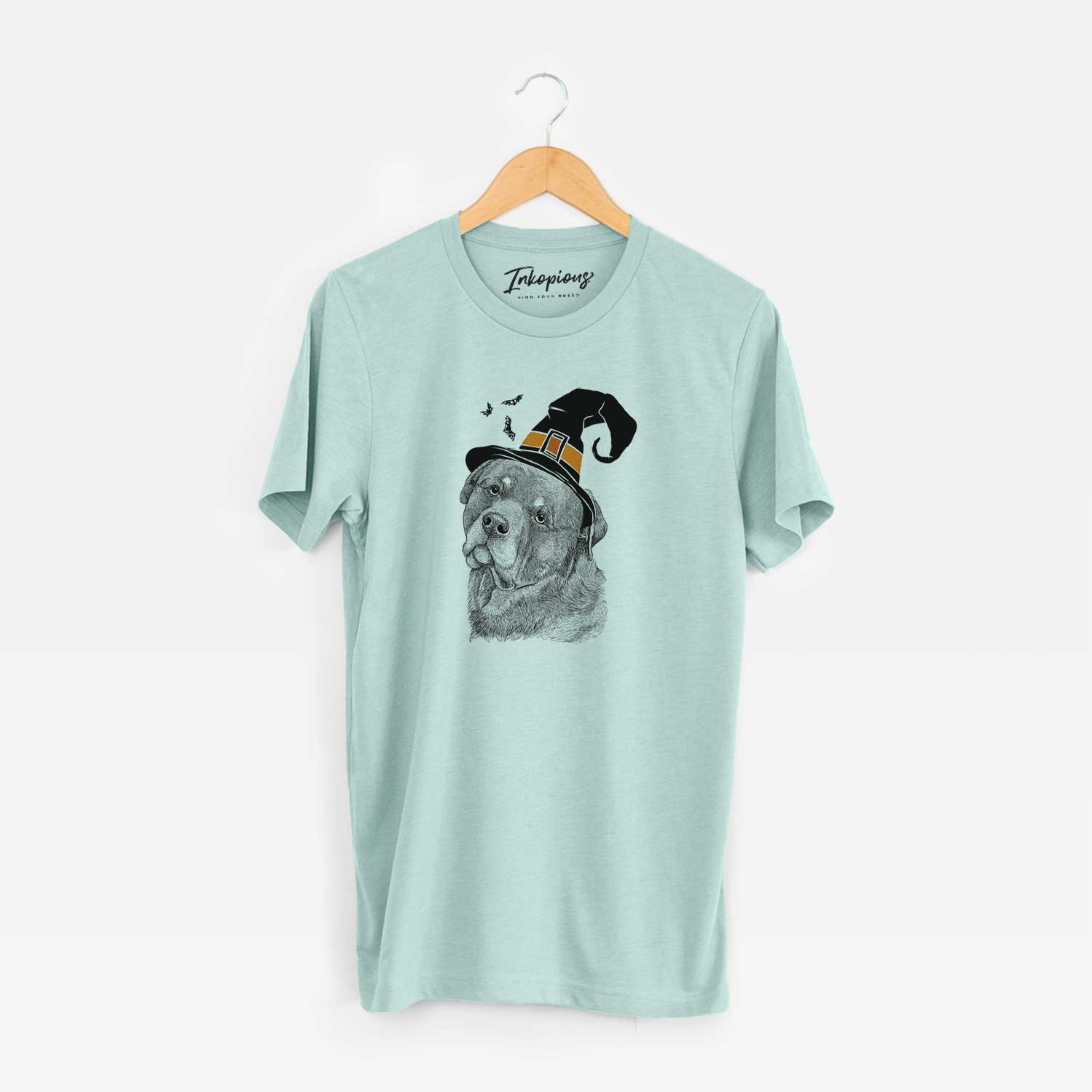Hand-drawn sketch of Bender the Rottweiler wearing a witch hat on a Heather Sage Unisex crewneck