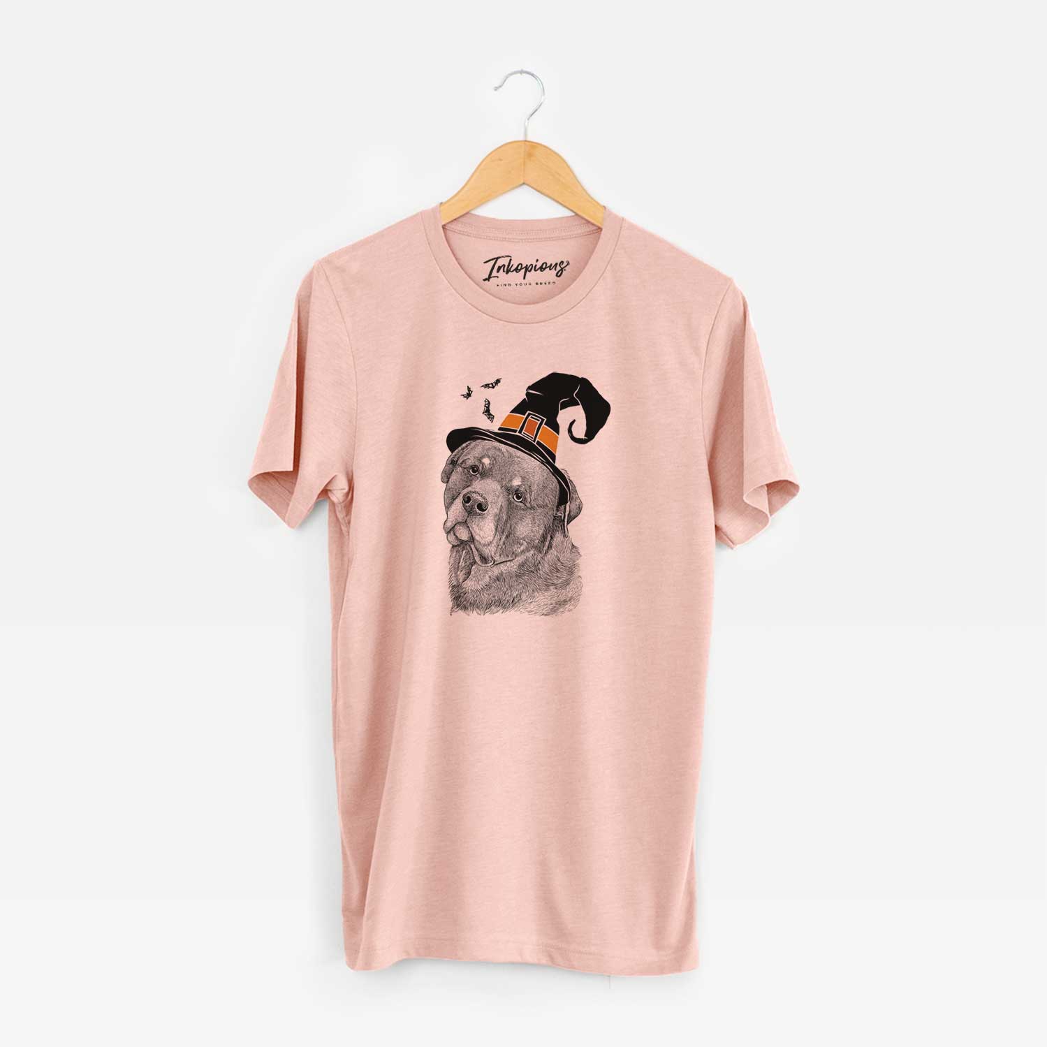 Hand-drawn sketch of Bender the Rottweiler wearing a witch hat on a Peach Unisex crewneck