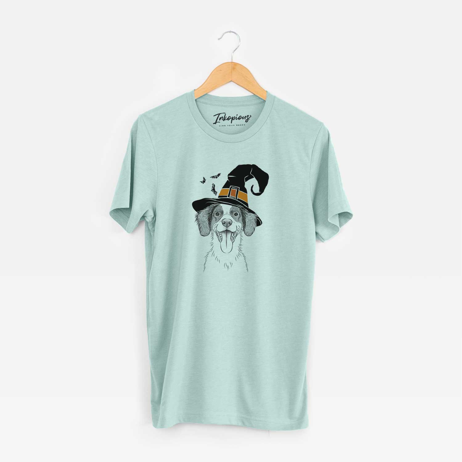 Hand-drawn sketch of Birdie the Brittany wearing a witch hat on a Heather Sage Unisex crewneck