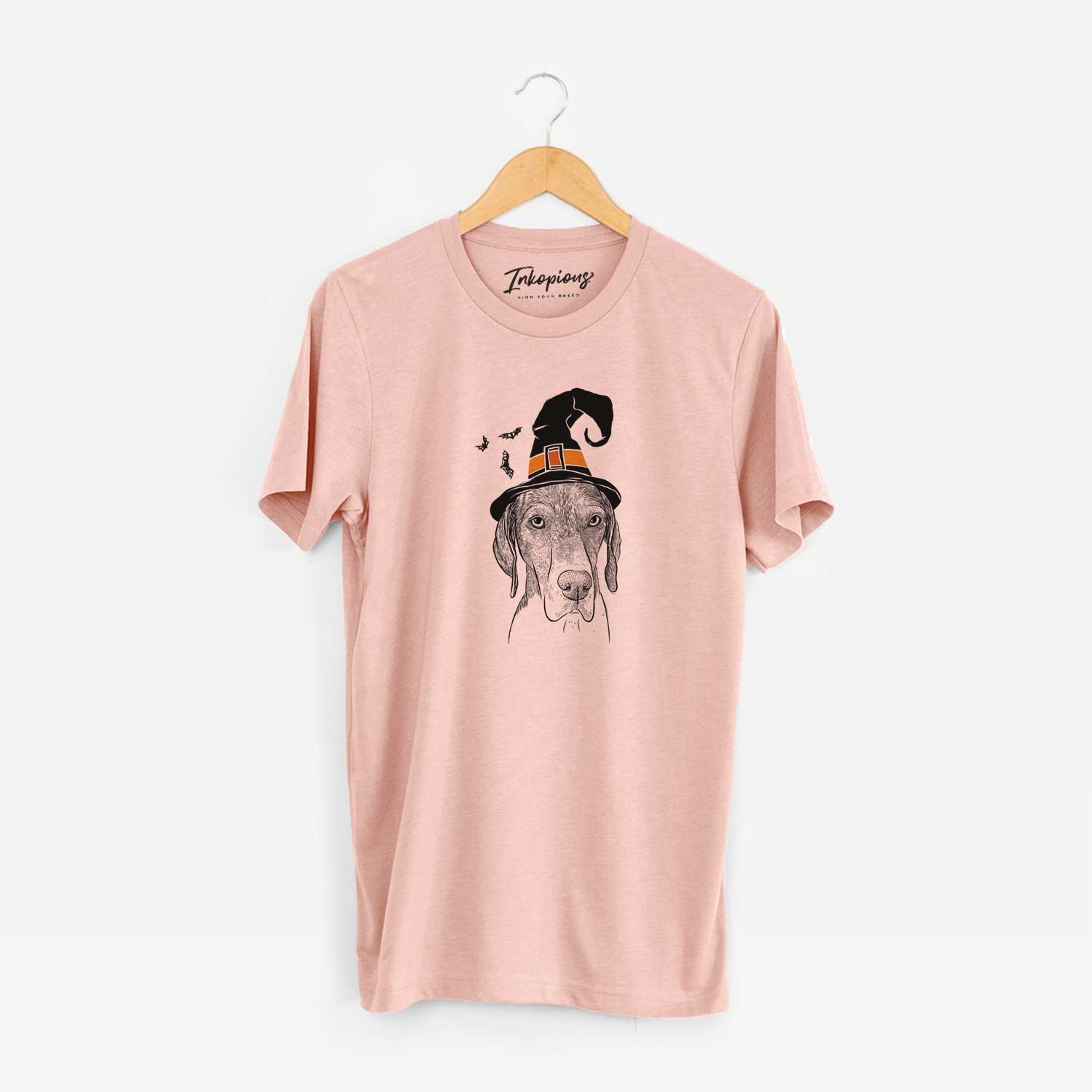 Hand-drawn sketch of Bohdi the German Shorthaired Pointer wearing a witch hat on a Peach Unisex crewneck