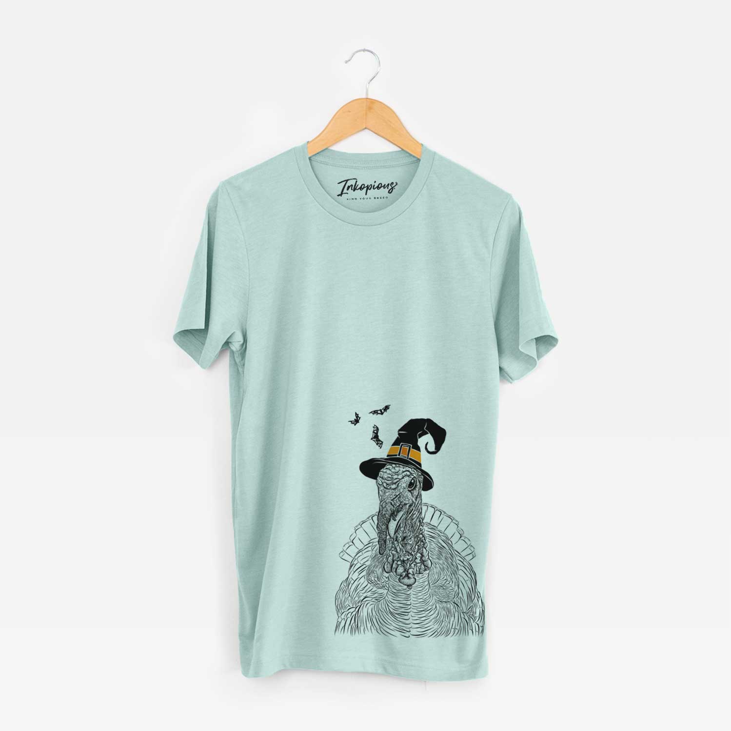 Hand-drawn sketch of Brady the Turkey wearing a witch hat on a Heather Sage Unisex crewneck