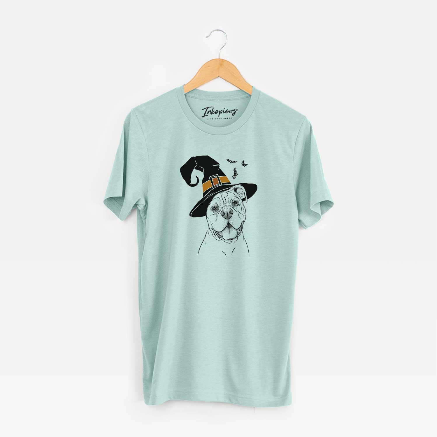 Hand-drawn sketch of Bravo the Bulldog Mix wearing a witch hat on a Heather Sage Unisex crewneck
