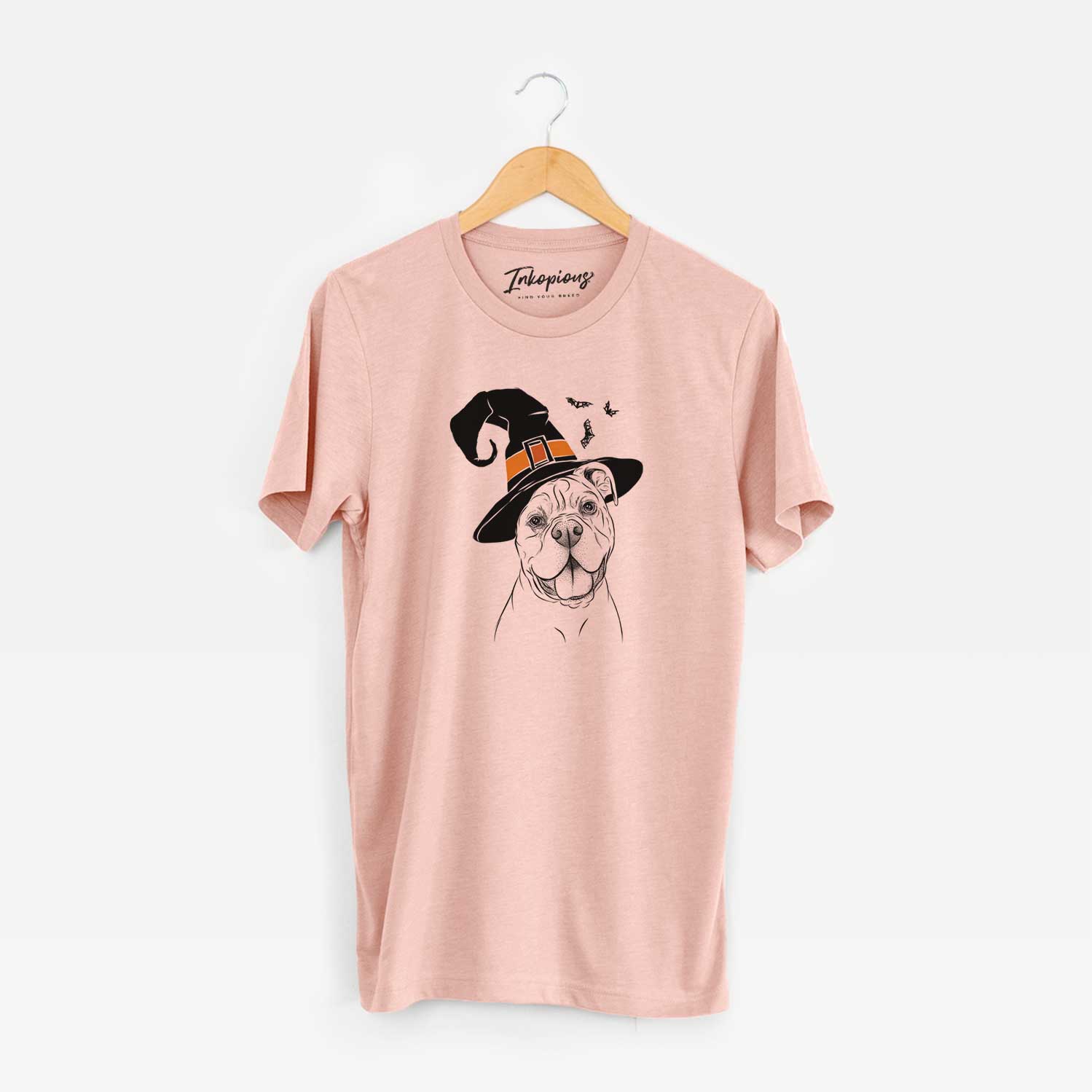 Hand-drawn sketch of Bravo the Bulldog Mix wearing a witch hat on a Peach Unisex crewneck