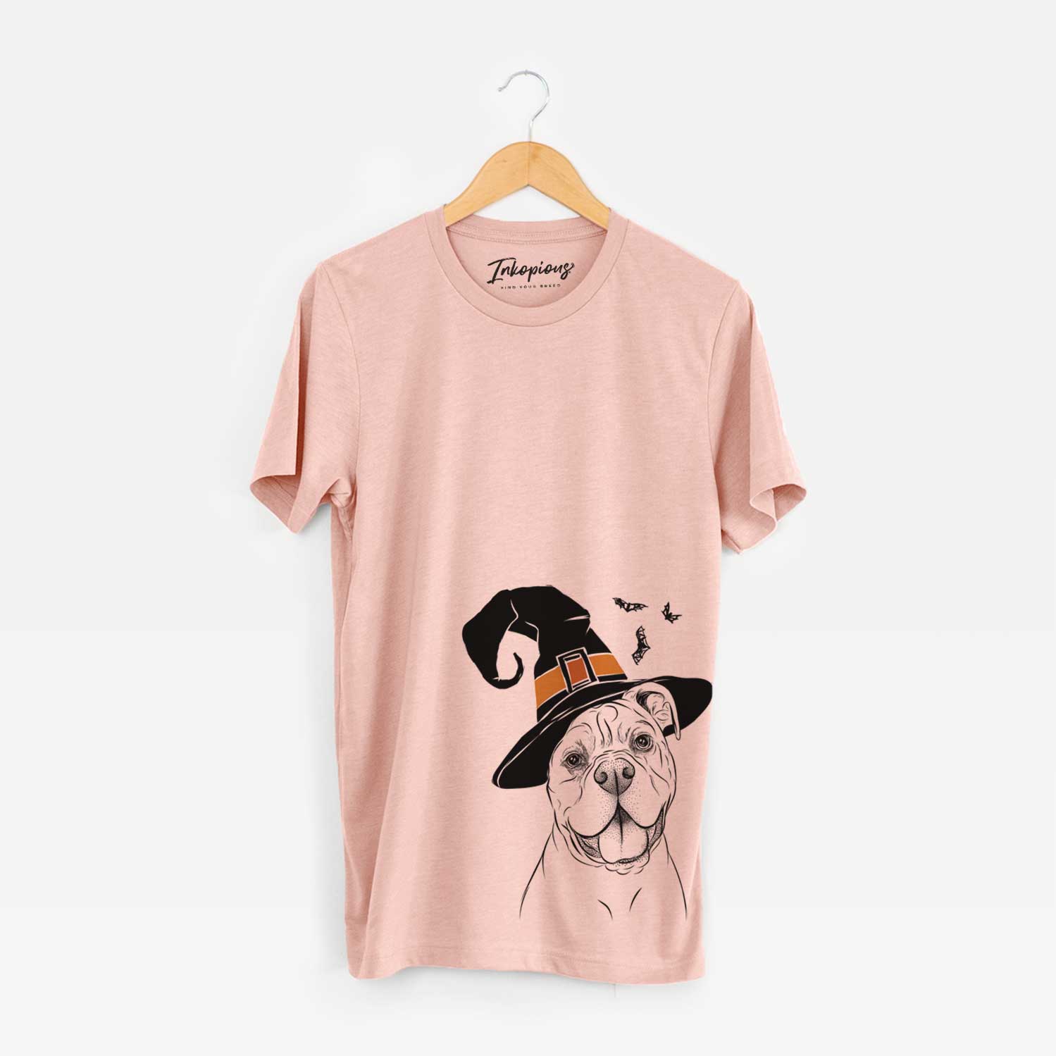 Hand-drawn sketch of Bravo the Bulldog Mix wearing a witch hat on a Peach Unisex crewneck