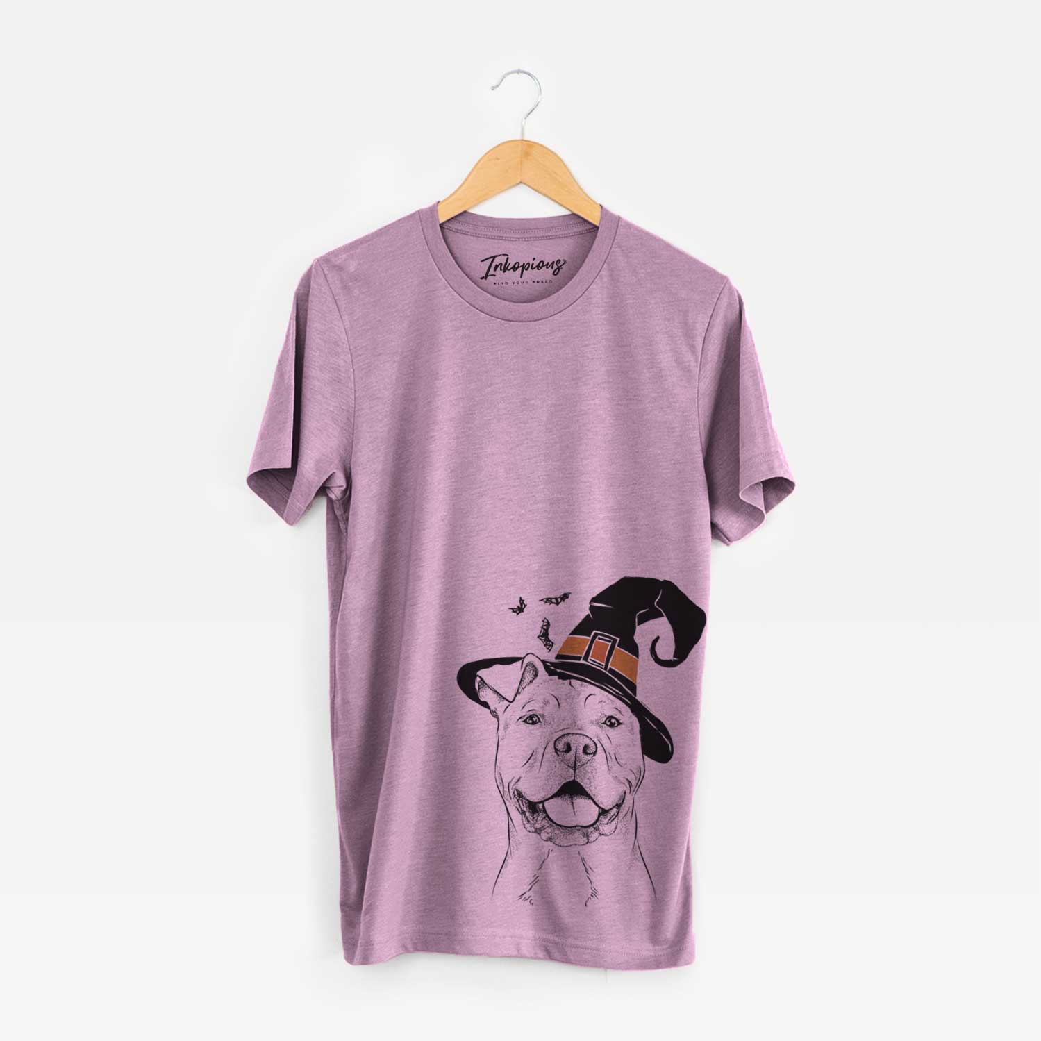 Hand-drawn sketch of Bubba Scraps the American Staffordshire Mix wearing a witch hat on an Orchid Unisex crewneck