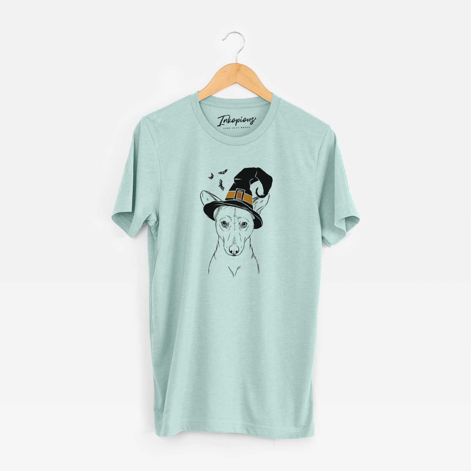 Hand-drawn sketch of Buff the Dorgi wearing a witch hat on a Heather Sage Unisex crewneck