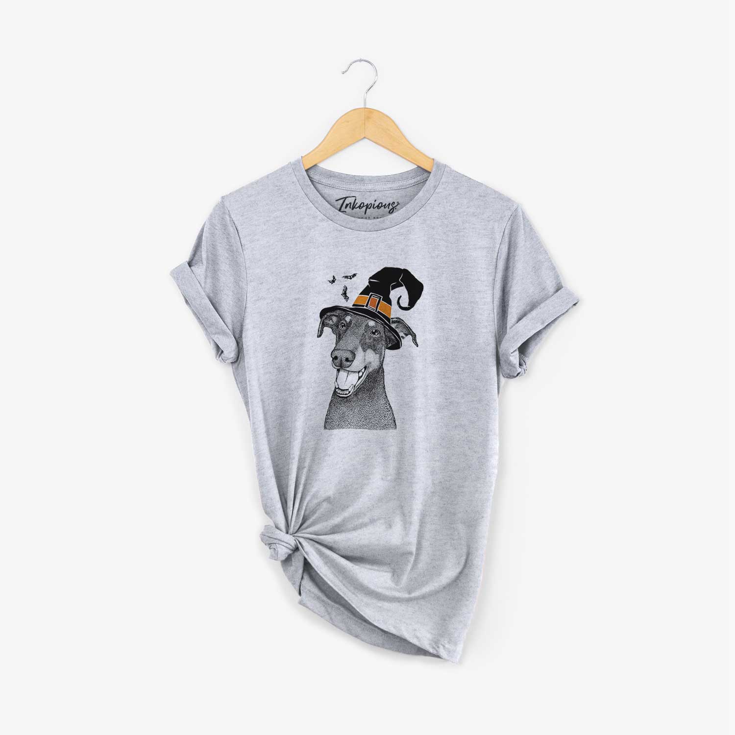 Hand-drawn sketch of Bunnie the Doberman Pinscher wearing a witch hat on a Grey Unisex crewneck