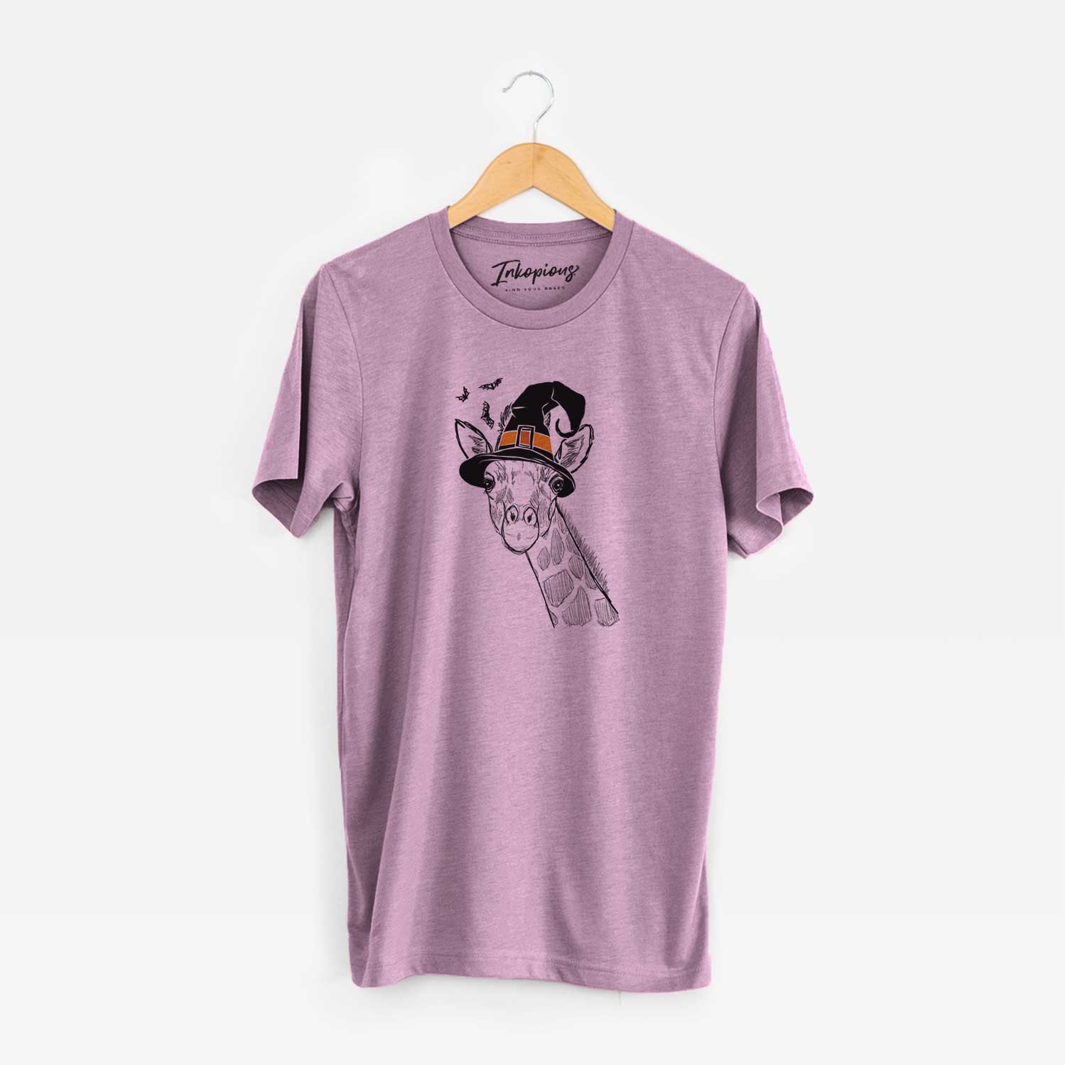 Hand-drawn sketch of Cedrick the Giraffe wearing a witch hat on an Orchid Unisex crewneck