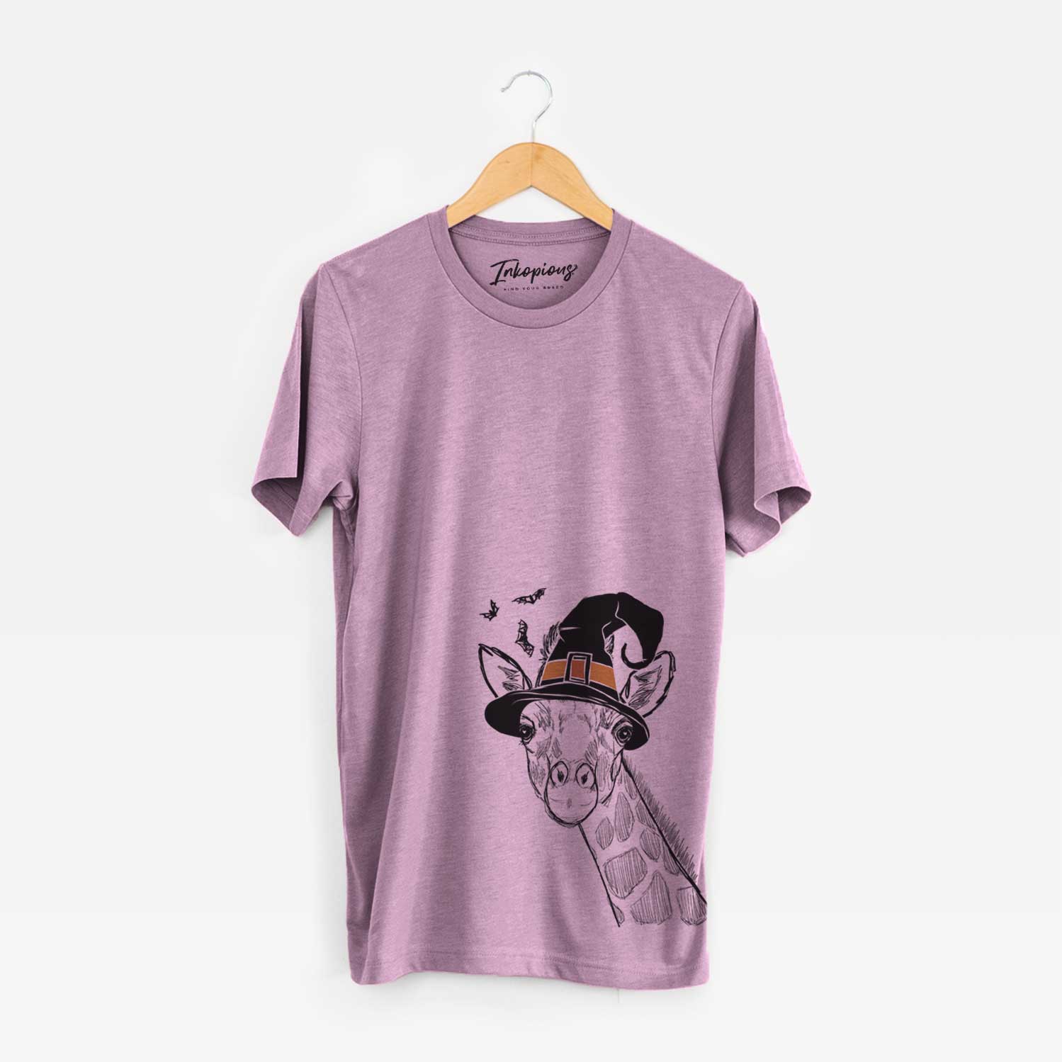 Hand-drawn sketch of Cedrick the Giraffe wearing a witch hat on an Orchid Unisex crewneck