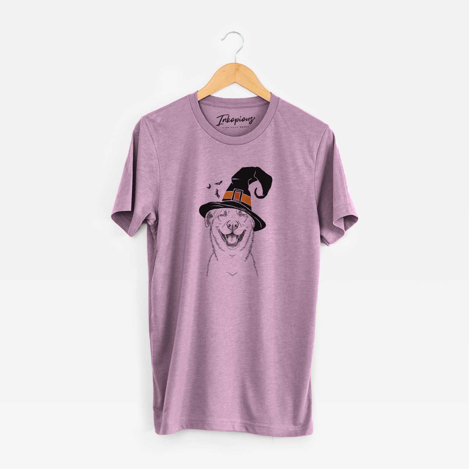 Hand-drawn sketch of Chancellor the Mixed Breed wearing a witch hat on an Orchid Unisex crewneck